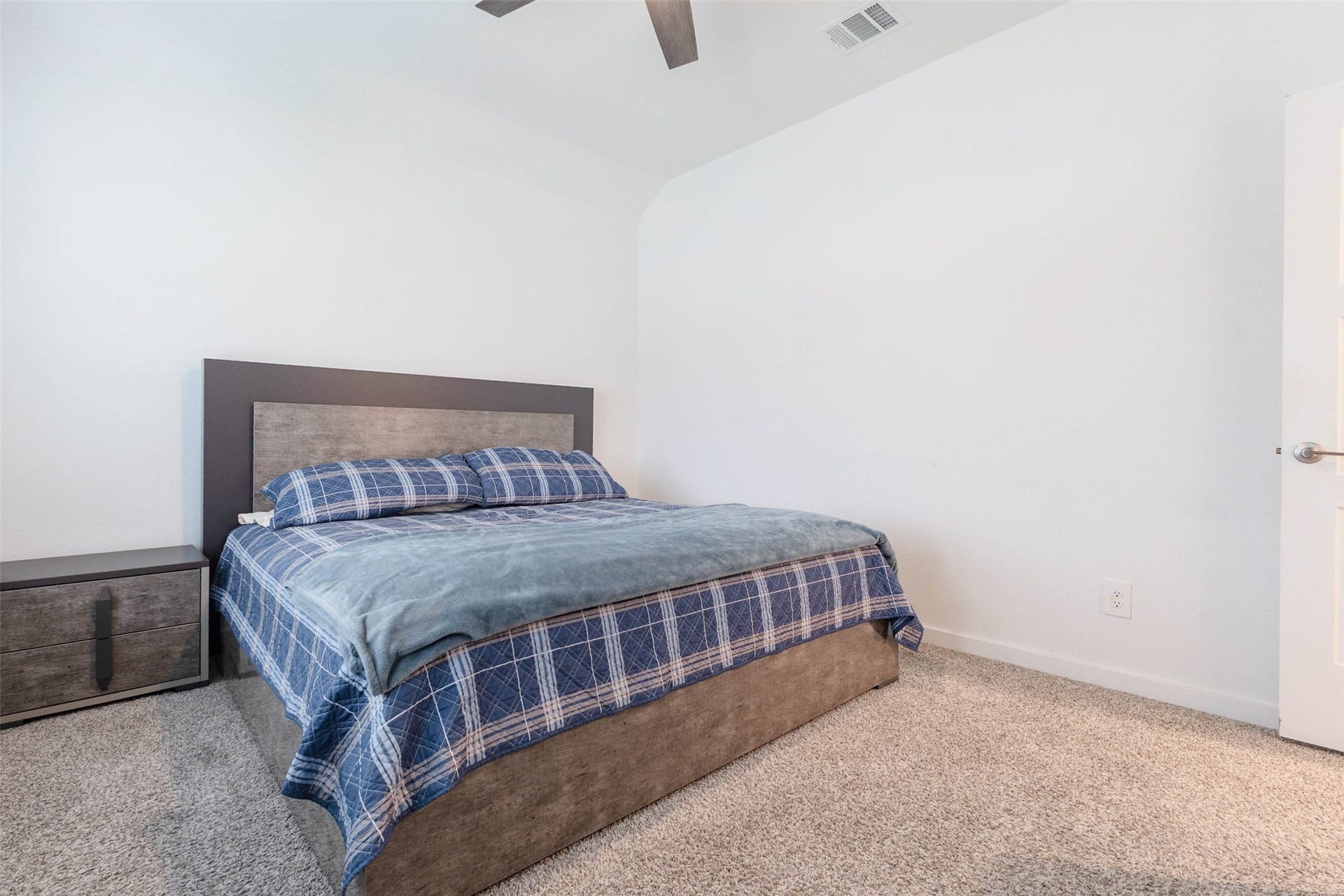 3205 Bello Green Lane, Katy, TX 77493 Bedroom with plaid bedding
