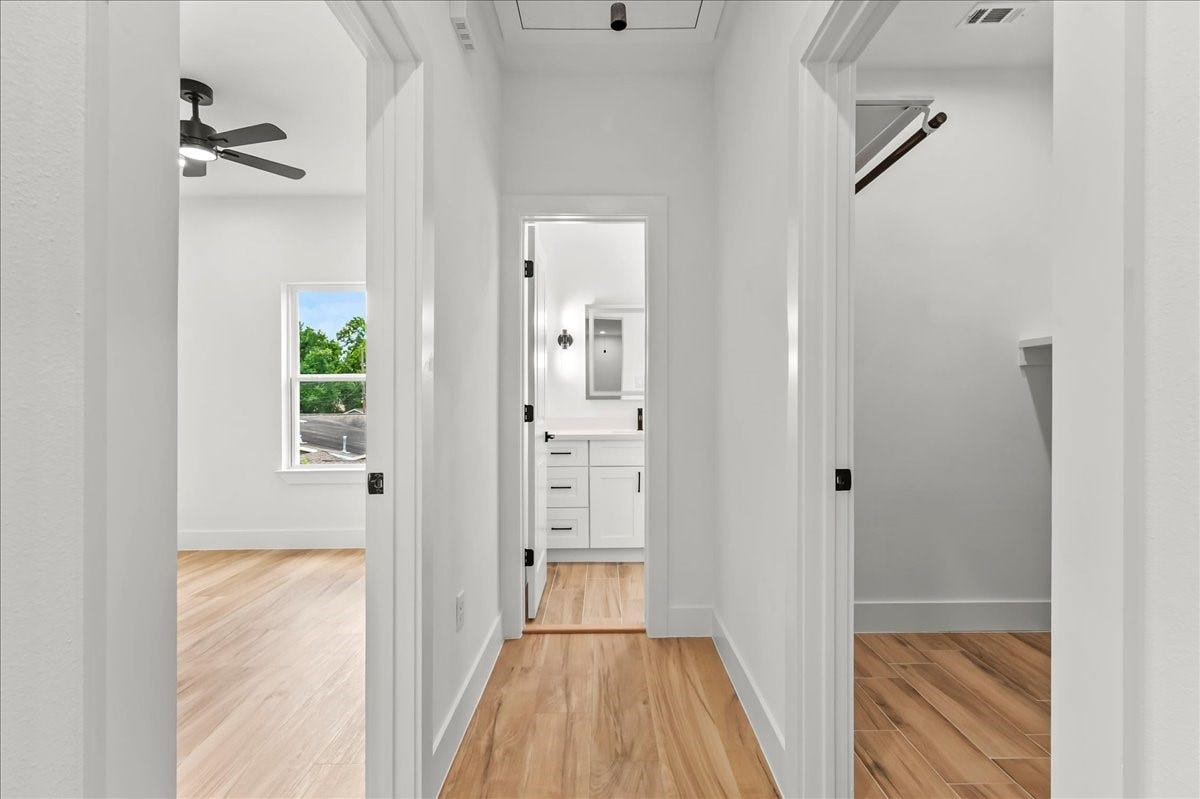 8323 Observatory Street, #A/B, Houston, TX 77088 Unit B - The thoughtfully designed second-level split floor plan offers added privacy and functionality, with the primary suite separated from the secondary bedrooms.