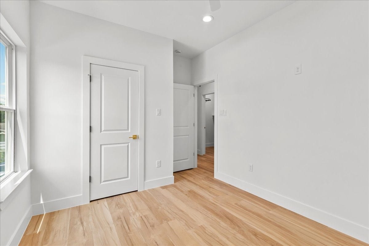 8323 Observatory Street, #A/B, Houston, TX 77088 Unit A - The secondary bedroom offers a bright and comfortable space with ample room for family, guests, or a home office.