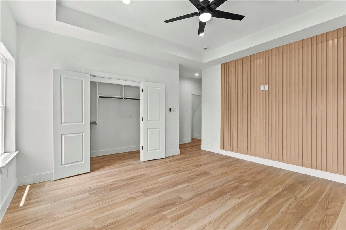 8323 Observatory Street, #A/B, Houston, TX 77088 Unit A - Luxurious primary suite.Accent Wall design may vary. Pictures are from a previous build.