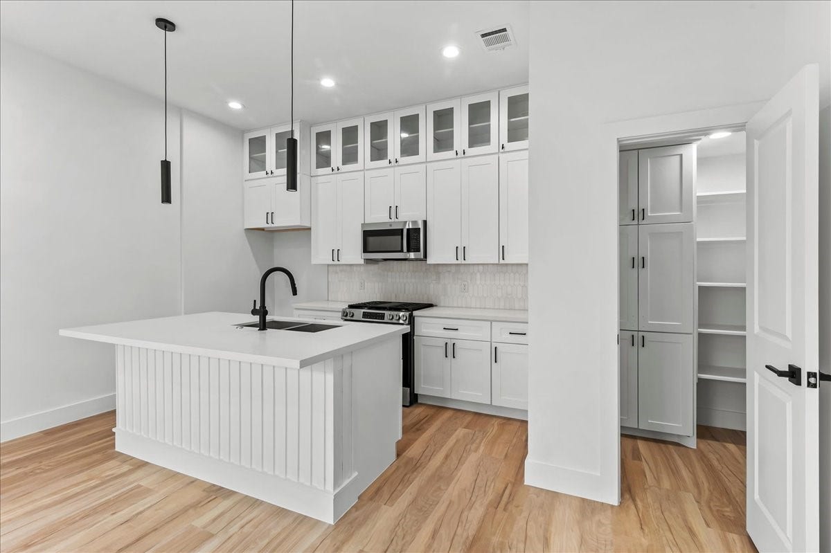 8323 Observatory Street, #A/B, Houston, TX 77088 Unit B - This thoughtful layout keeps everything within reach while maintaining a clean and organized space. Accent Wall design may vary. Pictures are from a previous build.