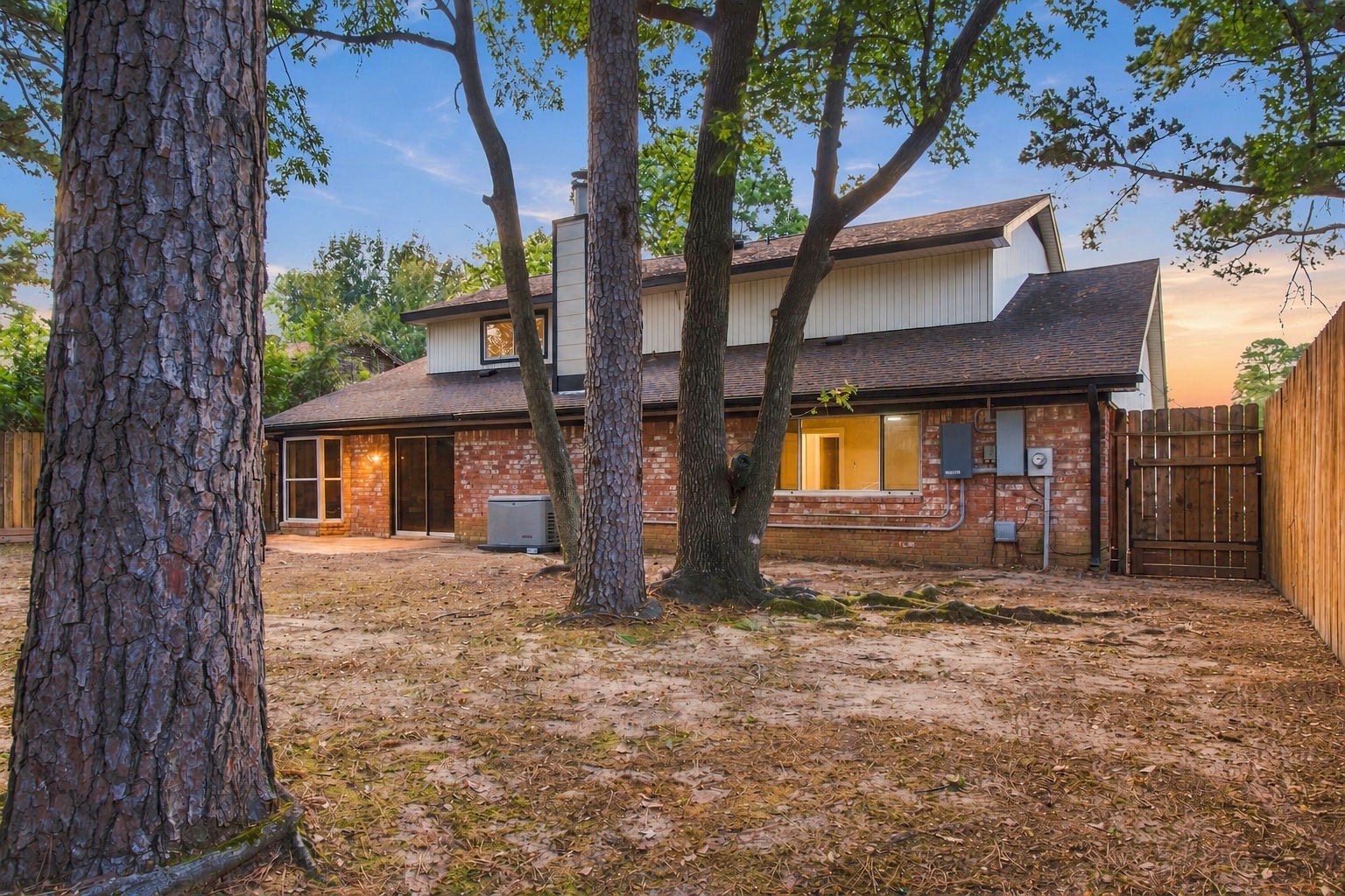 9631 Rannock Way, Spring, TX 77379 A sunset photo of the backyard - lots of room!