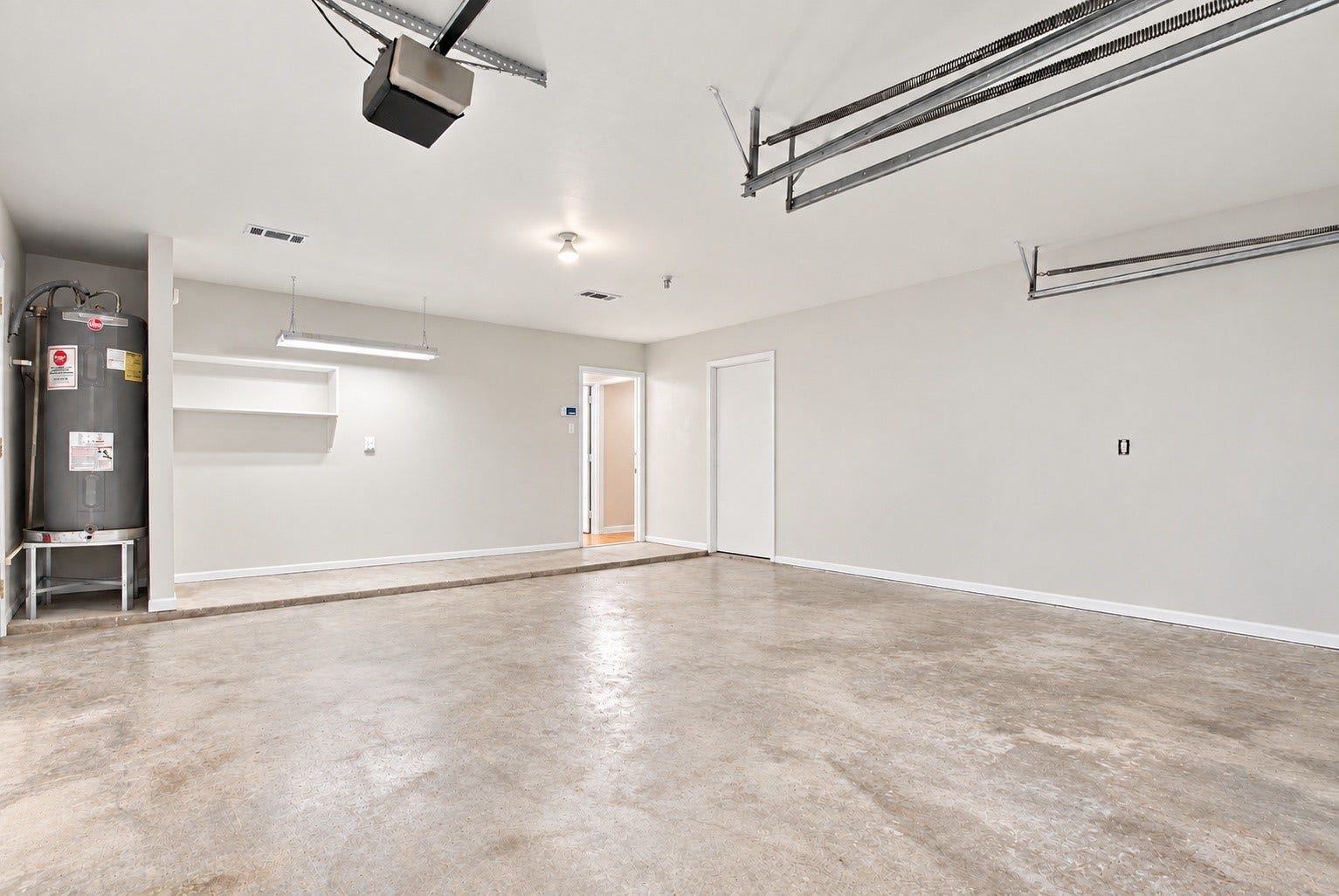 9631 Rannock Way, Spring, TX 77379 The two car garage with a BRAND NEW water heater and it has tesla charges!