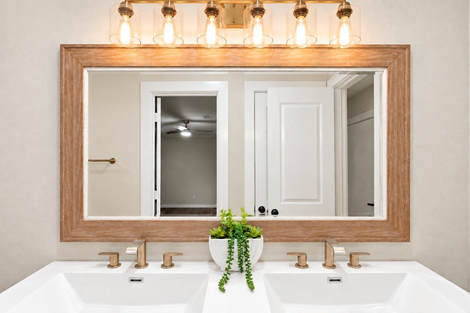 9631 Rannock Way, Spring, TX 77379 Upclose view of the light fixtures and the mirror that stays with the home!