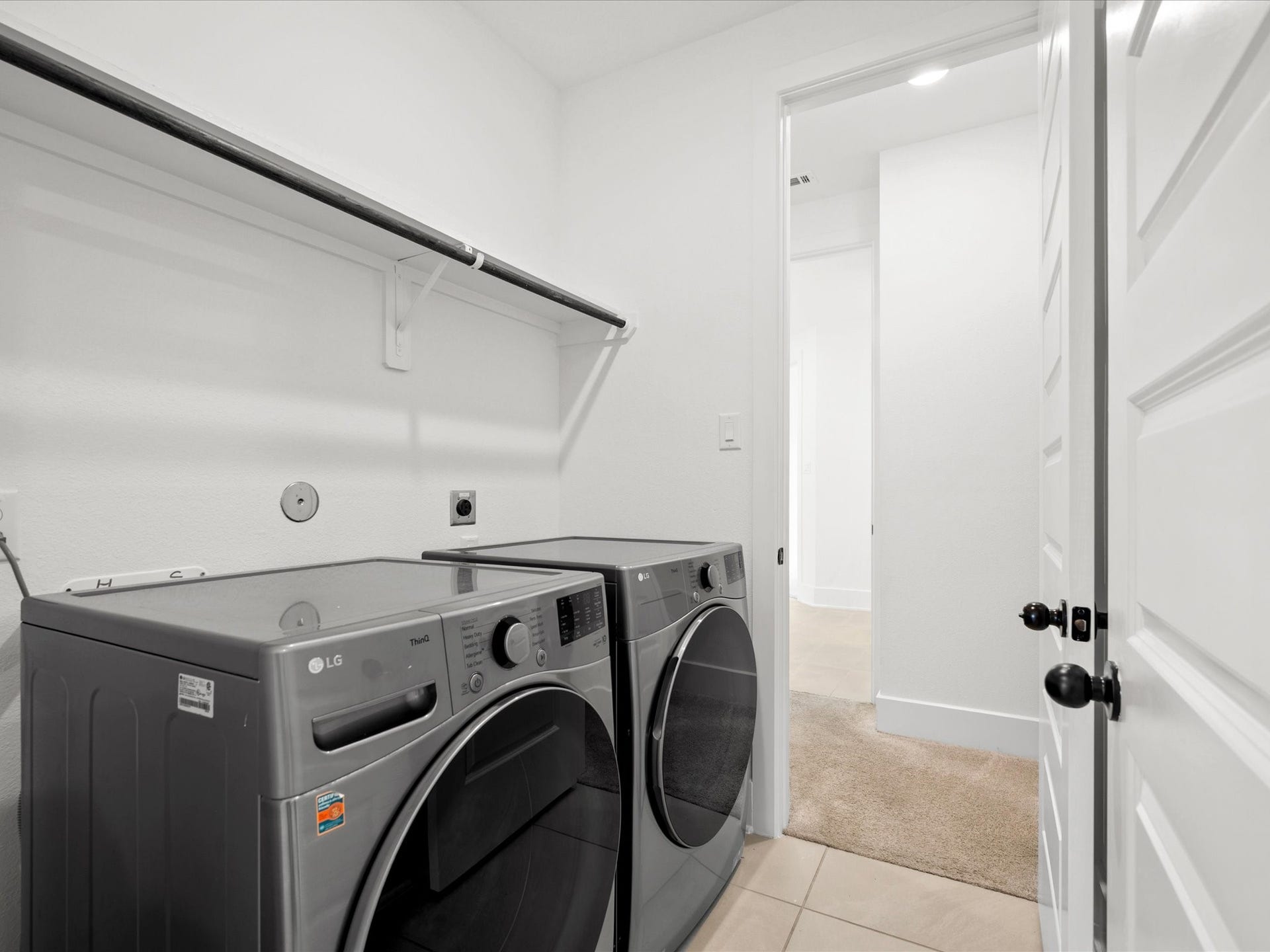 1911 Golden Leaf Drive, Missouri City, TX 77459 Convenient laundry room with built-in storage.