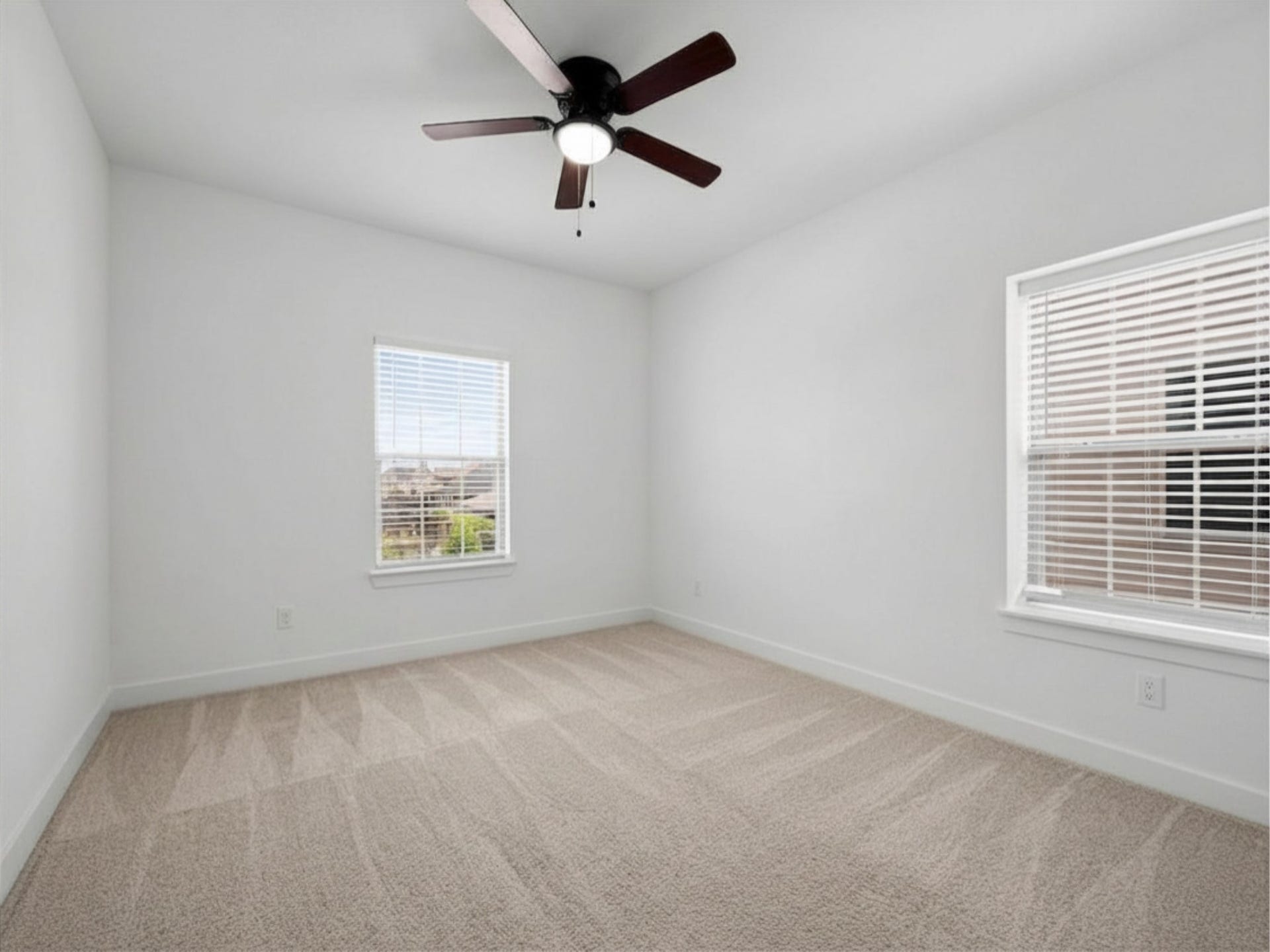1911 Golden Leaf Drive, Missouri City, TX 77459 Upstairs bedroom with ceiling fan and plush carpet.