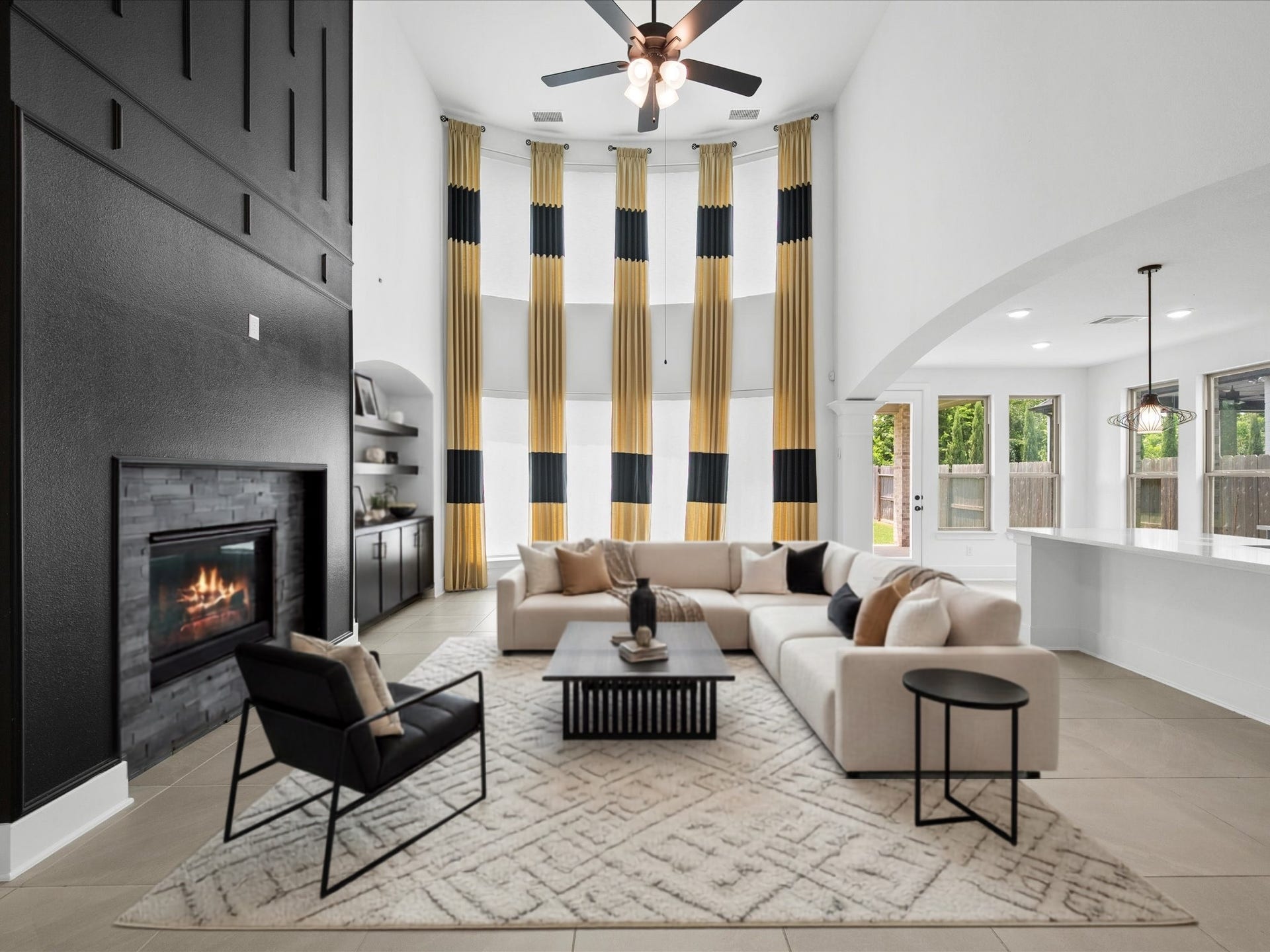 1911 Golden Leaf Drive, Missouri City, TX 77459 Family room with high ceilings and dramatic black accent detailing. *virtually staged*