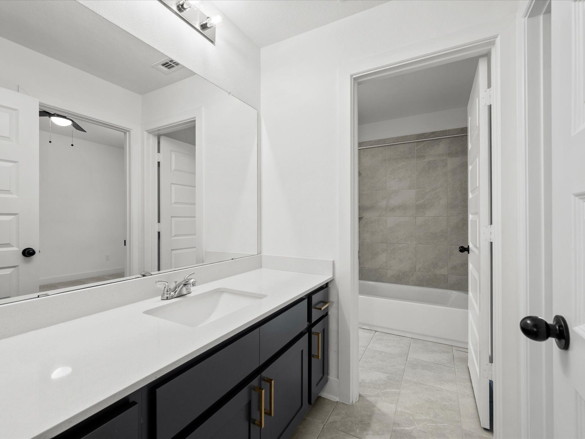 1911 Golden Leaf Drive, Missouri City, TX 77459 Upstairs bath vanity with quartz counters.