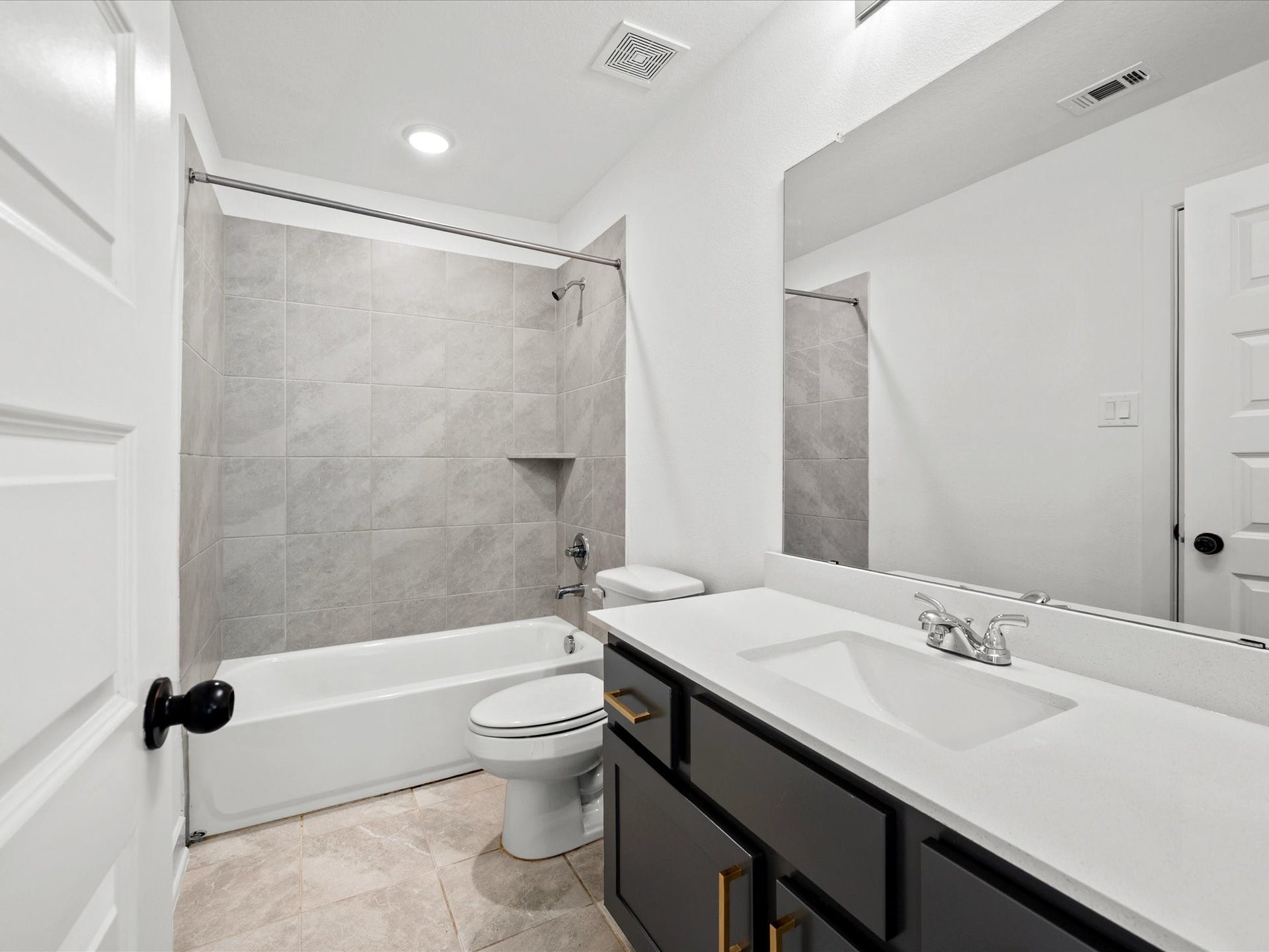 1911 Golden Leaf Drive, Missouri City, TX 77459 Upstairs bathroom with double vanity and clean modern finishes.