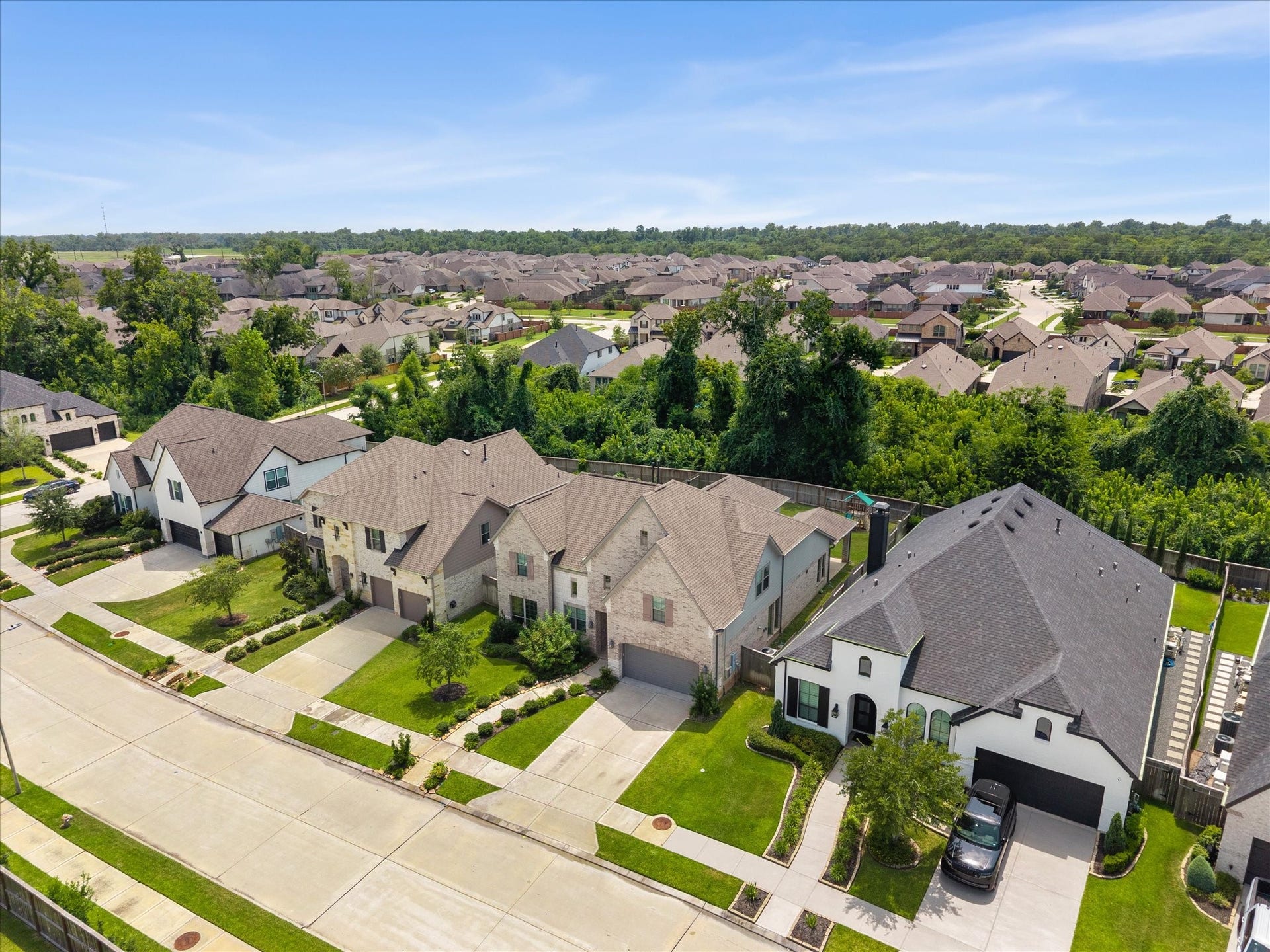 1911 Golden Leaf Drive, Missouri City, TX 77459 Aerial community view highlighting Siennas resort-style amenities nearby parks, trails, and more.