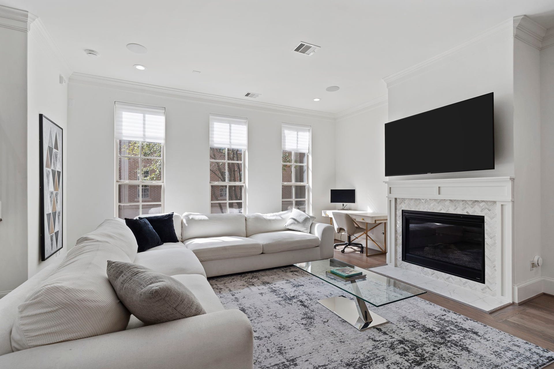 Spacious main living area with gas fireplace and tons of natural light.
