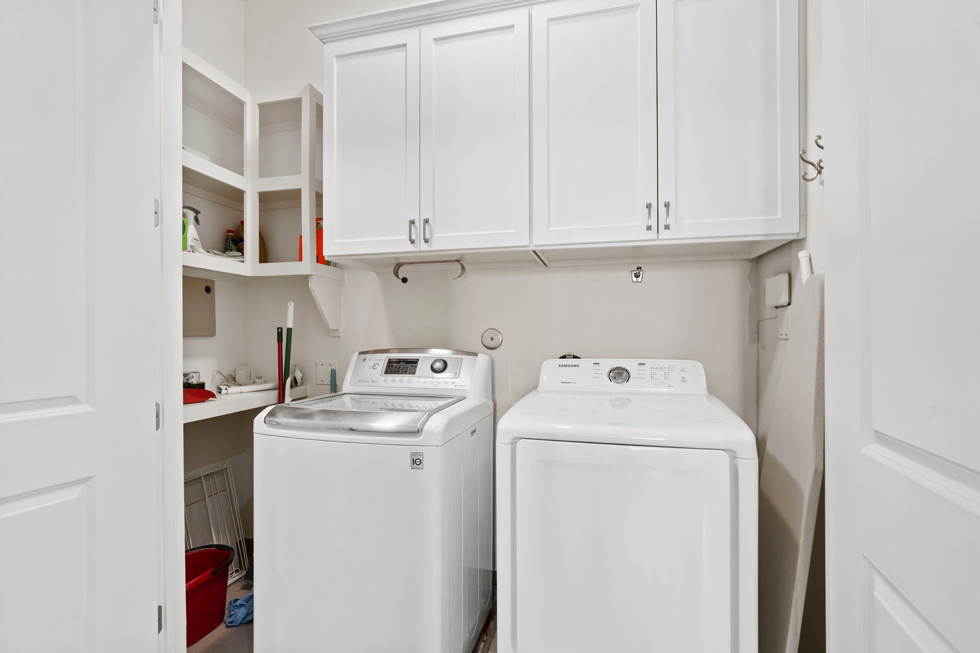 Utility room with washer and dryer.