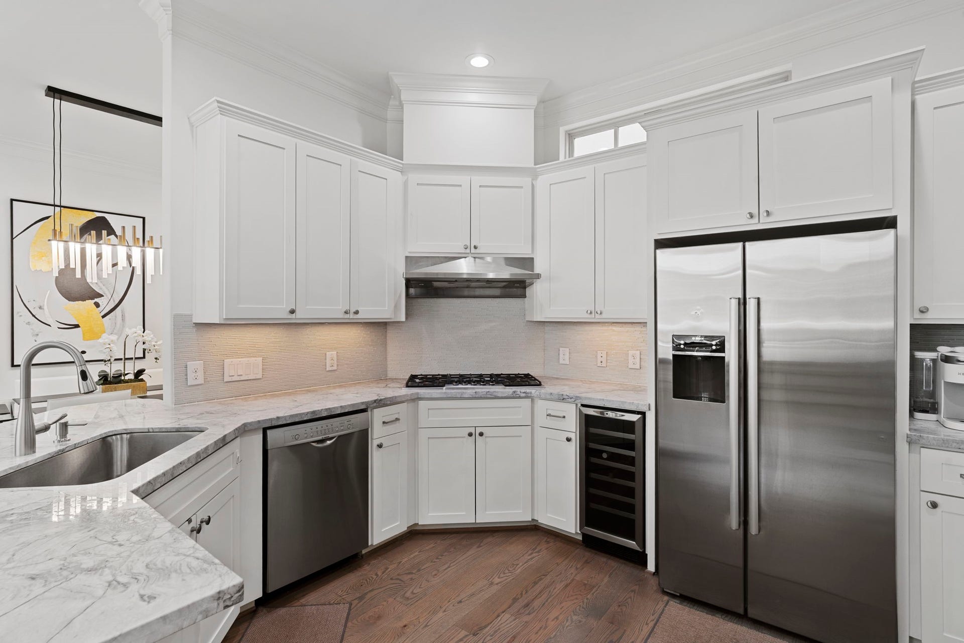 Updated kitchen with stainless steel appliances and ample counter space.
