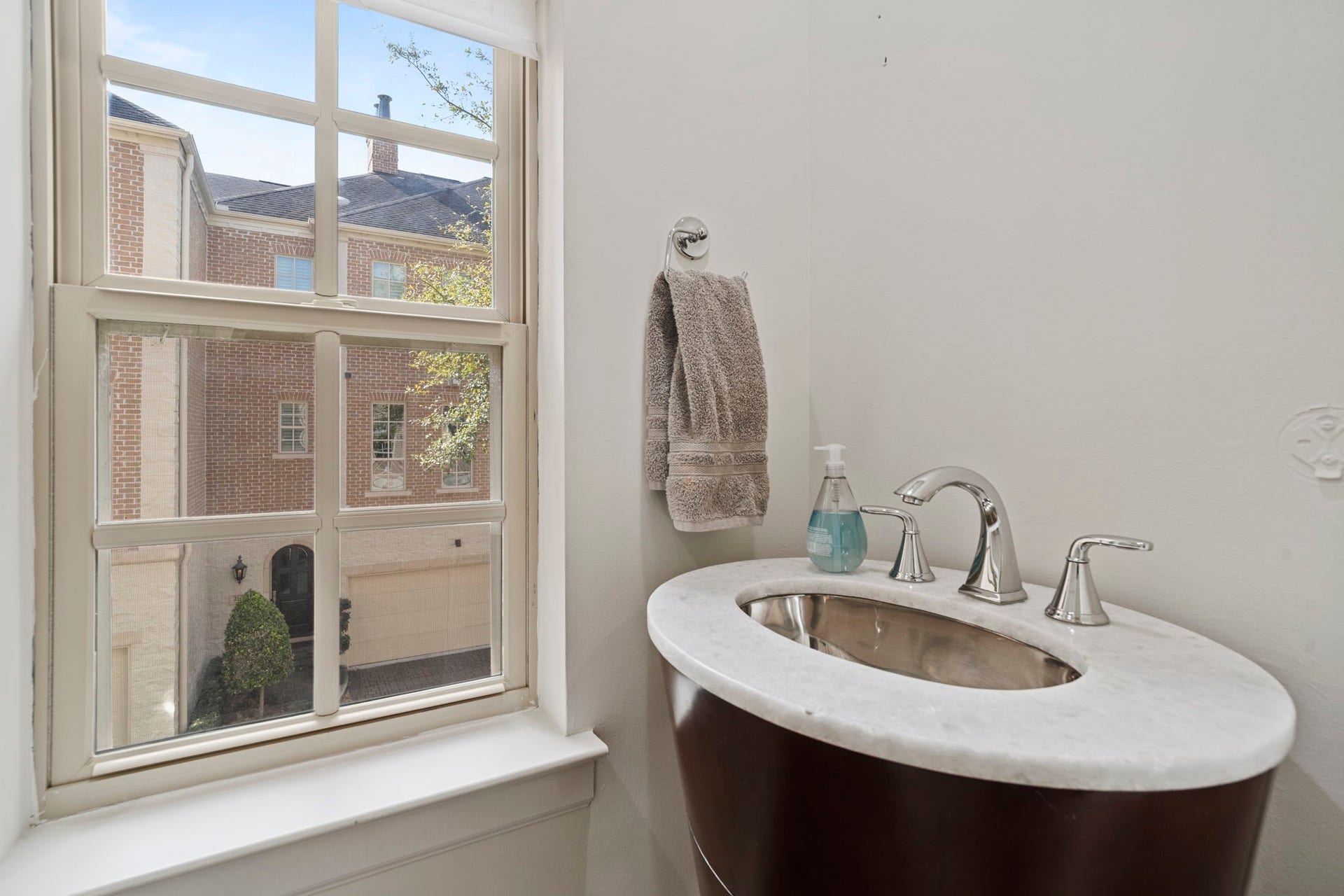 Half bathroom located right off the living room space on the 2nd floor.
