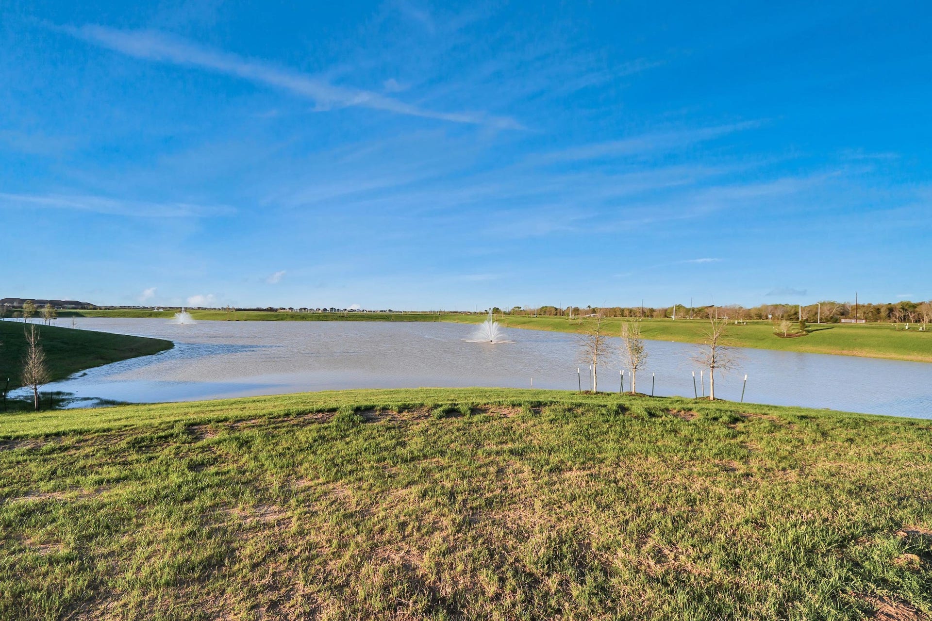 3096 Sunset Glory Drive, Katy, TX 77493 Experience breathtaking panoramic lake views from your future home, where serene waters meet expansive skies for the ultimate tranquil retreat.