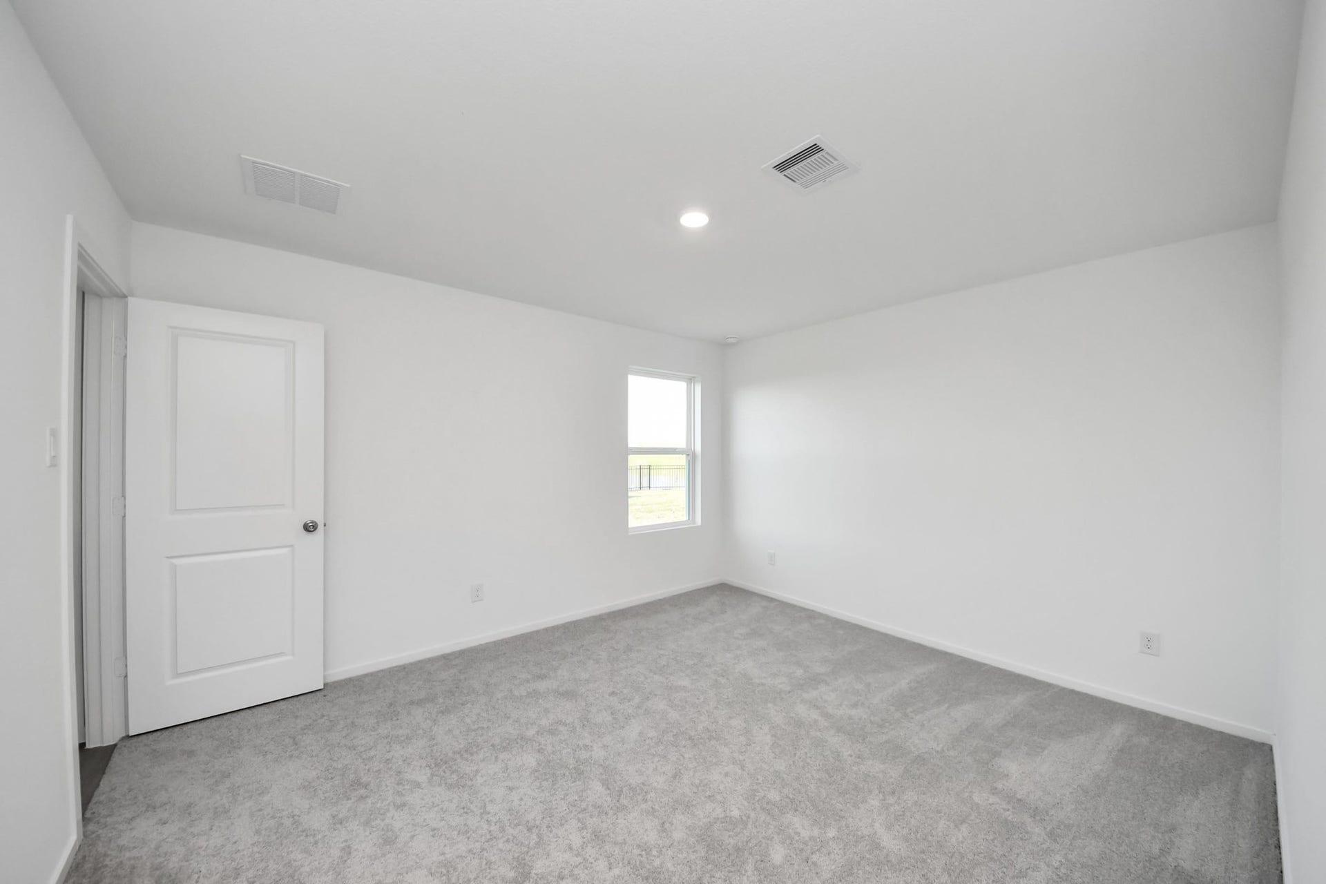 3096 Sunset Glory Drive, Katy, TX 77493 Experience tranquility in this spacious primary bedroom, featuring fresh, neutral tones and abundant natural light for a serene retreat.