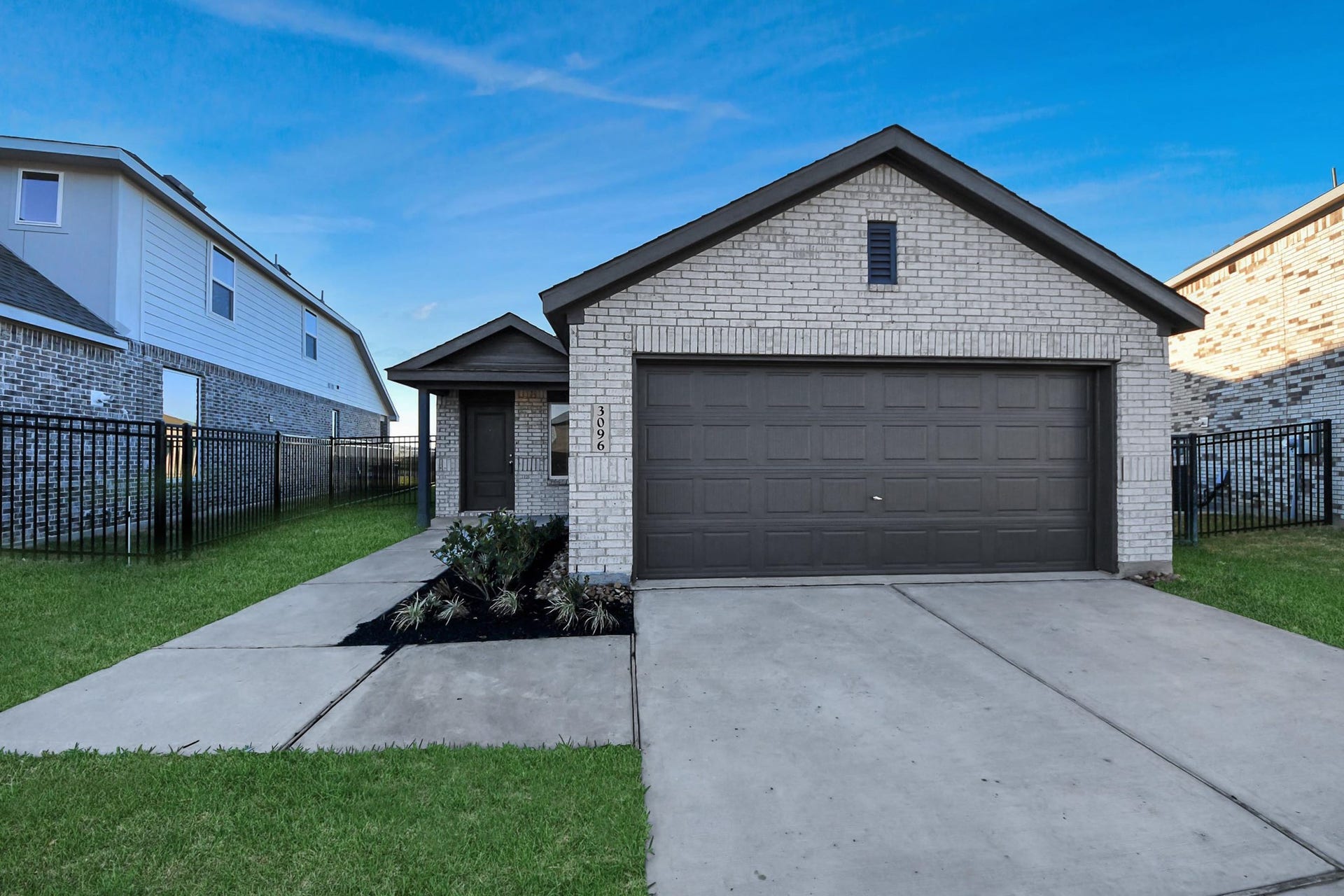 3096 Sunset Glory Drive, Katy, TX 77493 Charming single-story home with a modern brick exterior, two-car garage, and a neat front lawn. Located in a well-maintained neighborhood.