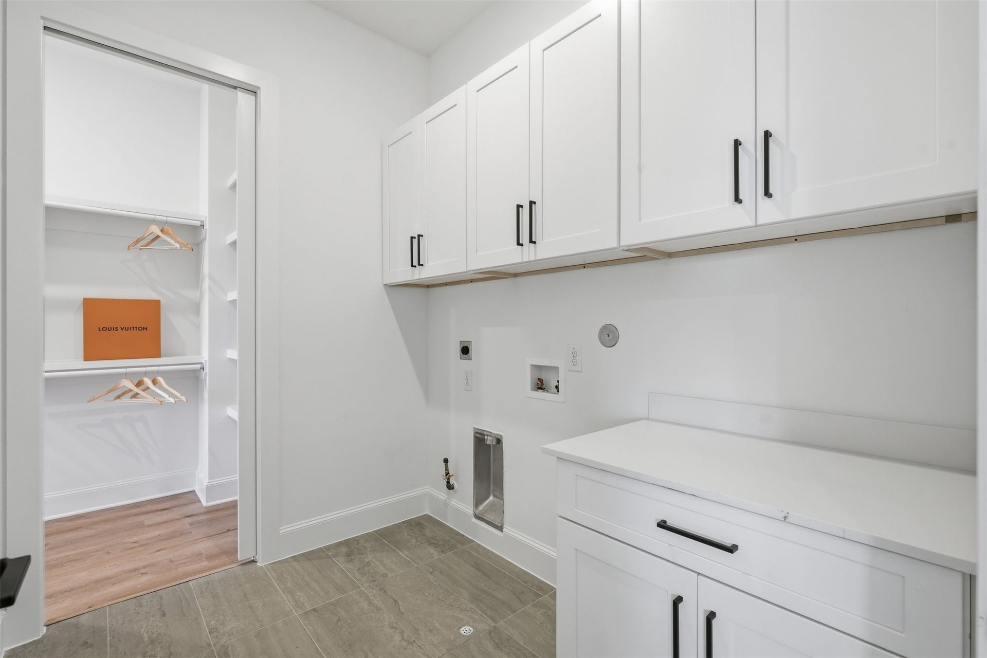 2111 Nantucket Drive, #C, Houston, TX 77057 The utility room offers abundant cabinetry, counter space, and convenient access to the primary closet for an exceptionally functional layout.