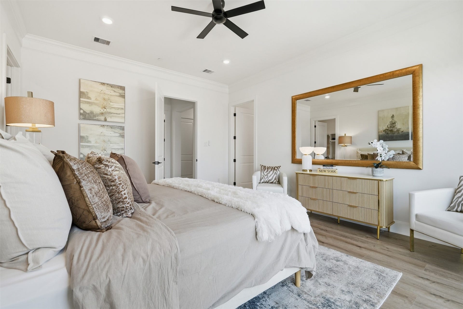 2111 Nantucket Drive, #C, Houston, TX 77057 The primary suite offers a spacious, serene retreat with warm finishes, generous proportions, and an elevated feel throughout.