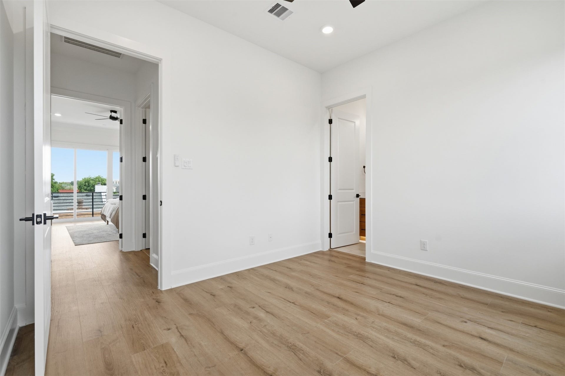 2111 Nantucket Drive, #C, Houston, TX 77057 Another view of the secondary bedroom highlights its comfortable proportions and convenient placement near the primary suite.