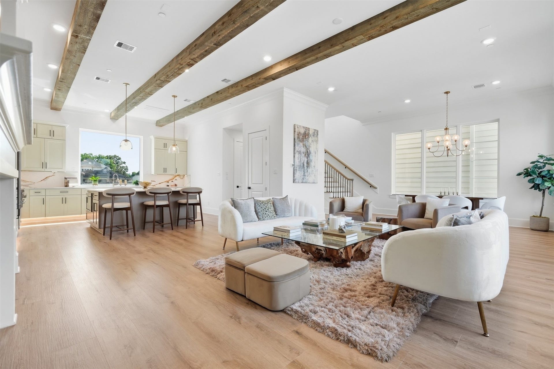 2111 Nantucket Drive, #C, Houston, TX 77057 The open-concept living, dining, and kitchen spaces come together beneath striking real cedar beams, bringing warmth and character to the heart of the home.