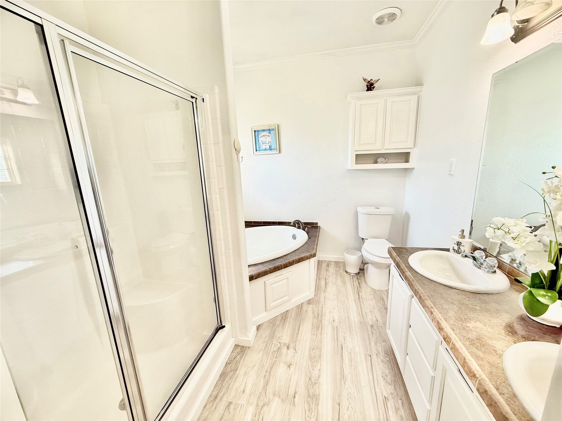 981 Nassau Drive, Crystal Beach, TX 77650 Primary restroom with separate tub and shower.