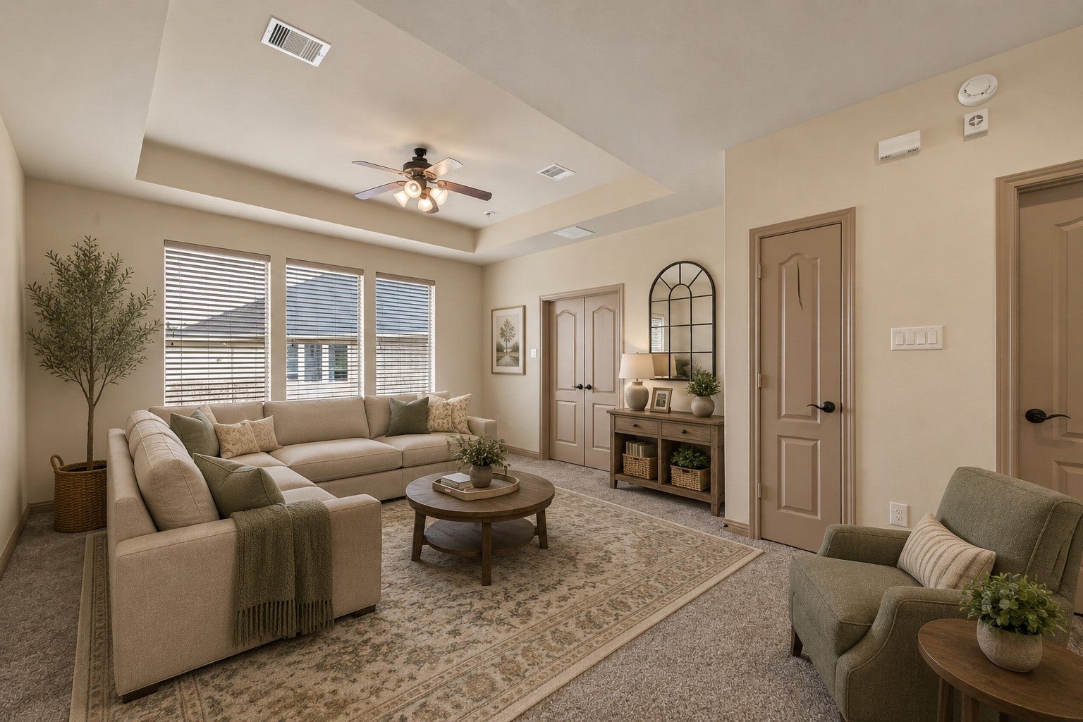 27411 Manor Falls Lane, Fulshear, TX 77441 This versatile sitting area features a tray ceiling with a ceiling fan, plush carpeting, and large windows that fill the space with natural light. Double doors provide access to additional rooms, making it an ideal secondary living space, media room, or relaxation retreat. (Virtually staged)