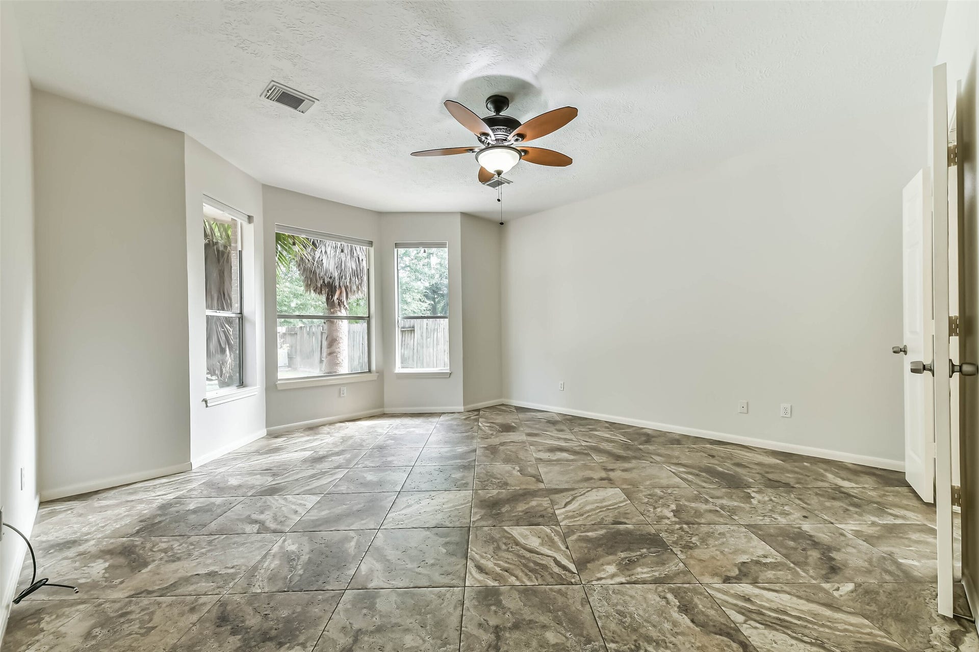 A restful retreat with room to make unwinding part of your daily routine. The bay window creates a natural spot for a reading chair and morning coffee, while tile flooring offers easy upkeep and a distinctive foundation for your furnishings.