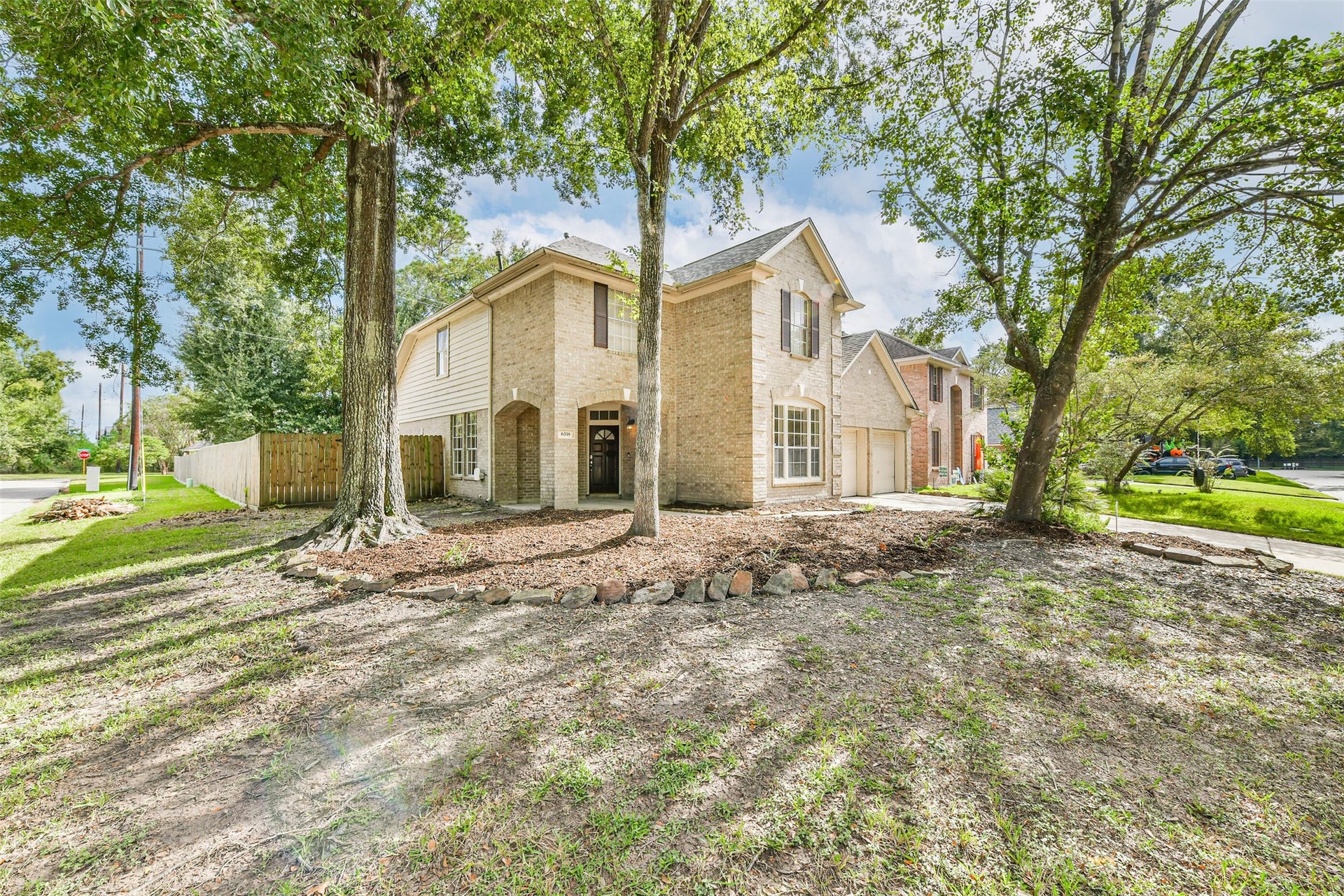 Mature shade trees give this corner setting a sense of place that takes years to grow. The broad front yard offers room to add your own landscaping touches, while the homes two-story profile creates a distinctive presence along the street.