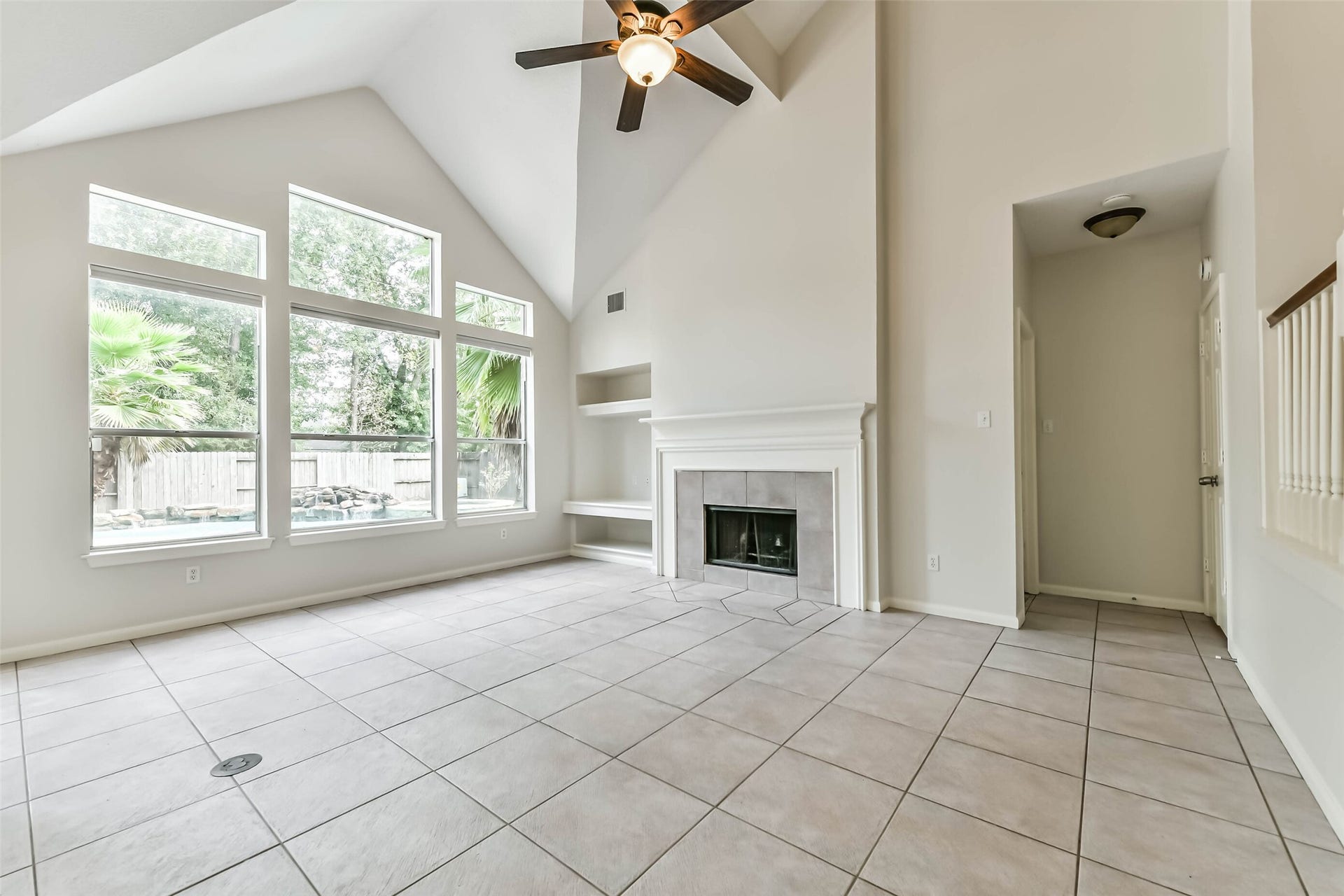Let the backyard become part of your everyday backdrop. Tall windows bring natural light and pool views into the living room, while the fireplace offers a cozy focal point for quiet evenings and conversation.