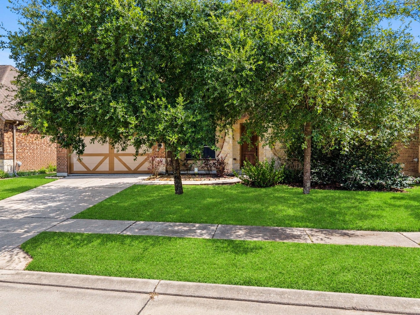 26111 Tintagel Lane, Kingwood, TX 77339 Mature shade trees frame a stately entry and freshly manicured lawn, pure curb appeal from the moment you arrive!