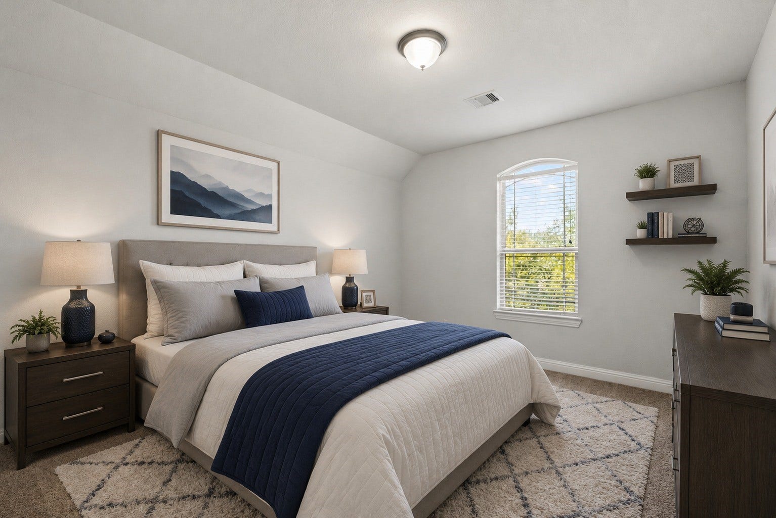 26111 Tintagel Lane, Kingwood, TX 77339 Virtually Stagged - Cozy secondary bedroom features a charming arched window and vaulted ceiling, a light-filled retreat with peaceful treetop views!
