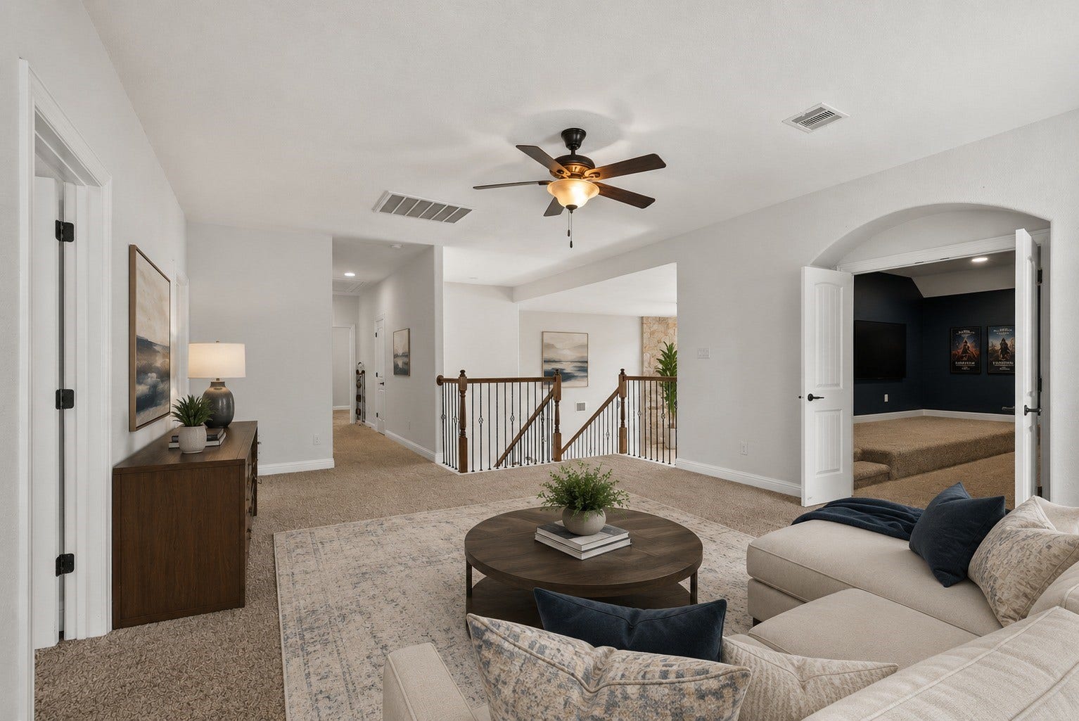 26111 Tintagel Lane, Kingwood, TX 77339 Virtually Stagged - Expansive upstairs game room overlooks the wrought-iron staircase and opens to a theater/media room, endless possibilities for entertainment!