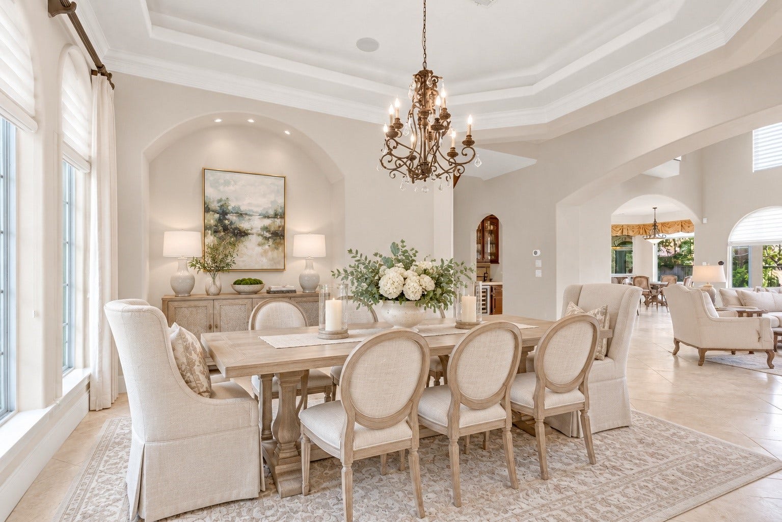 Gracious formal dining room with soaring ceilings and abundant natural light.