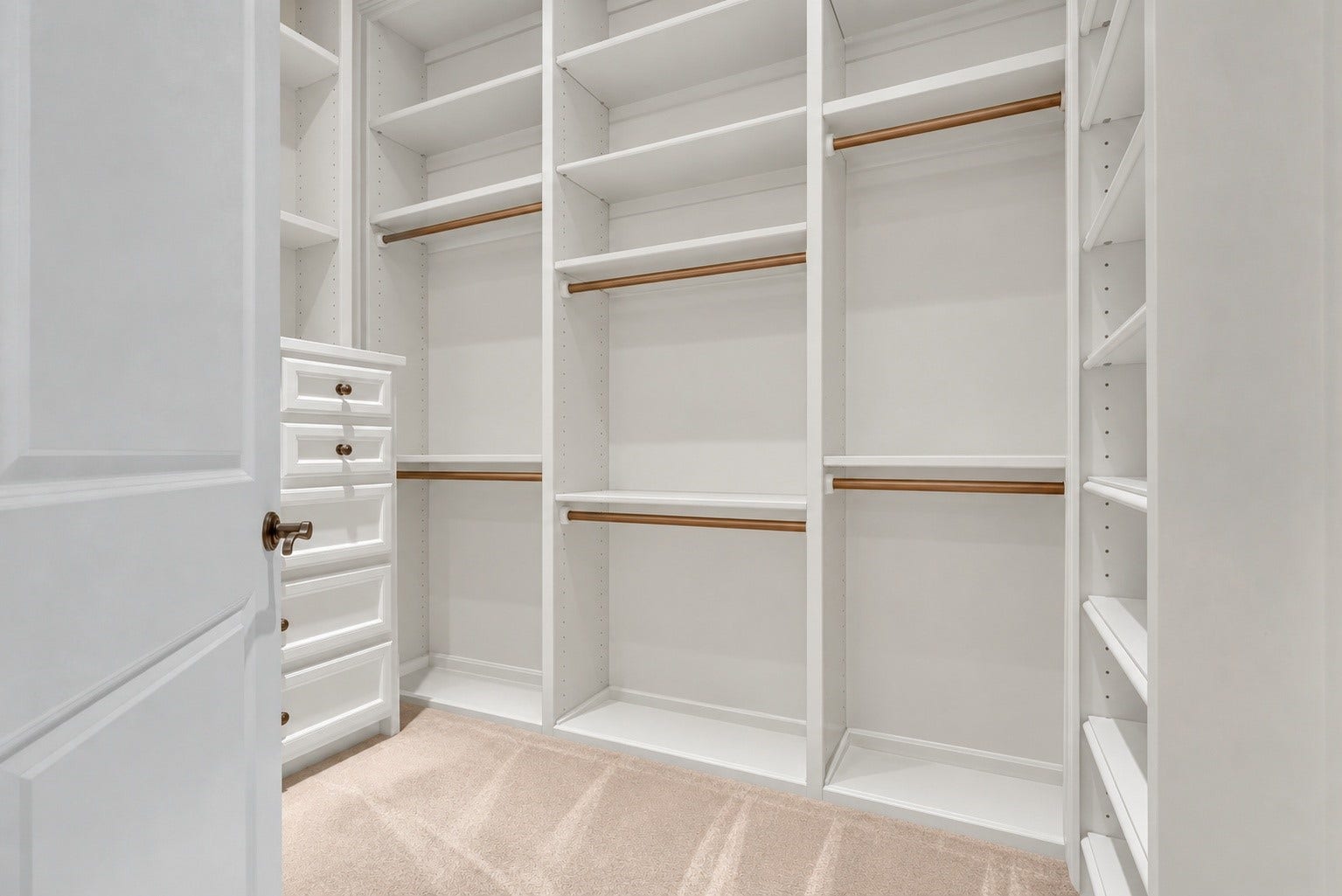 Spacious His/Her custom walk-in closets located in the primary bedroom with extensive built-in storage.