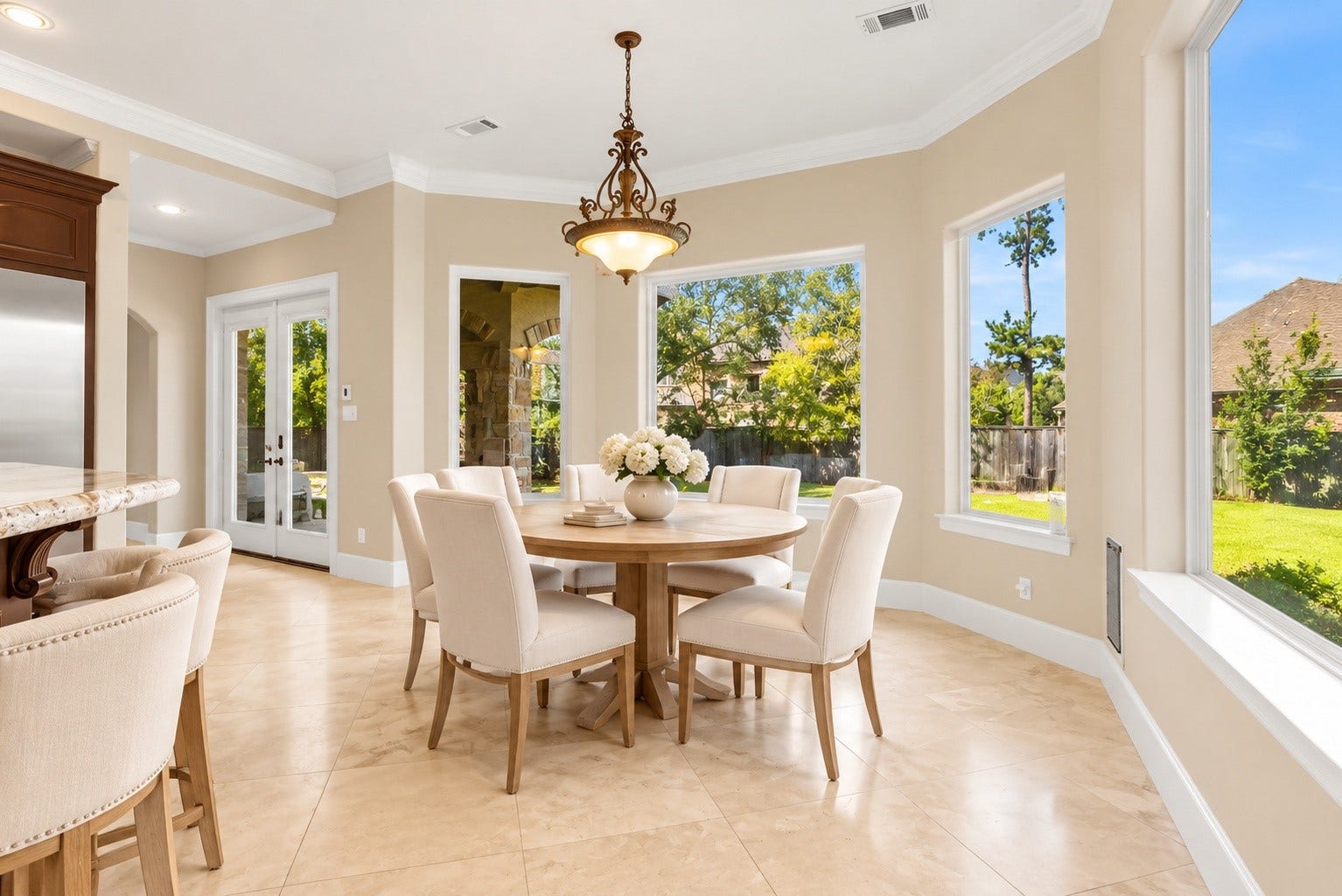 Light-filled breakfast room overlooking the expansive backyard.