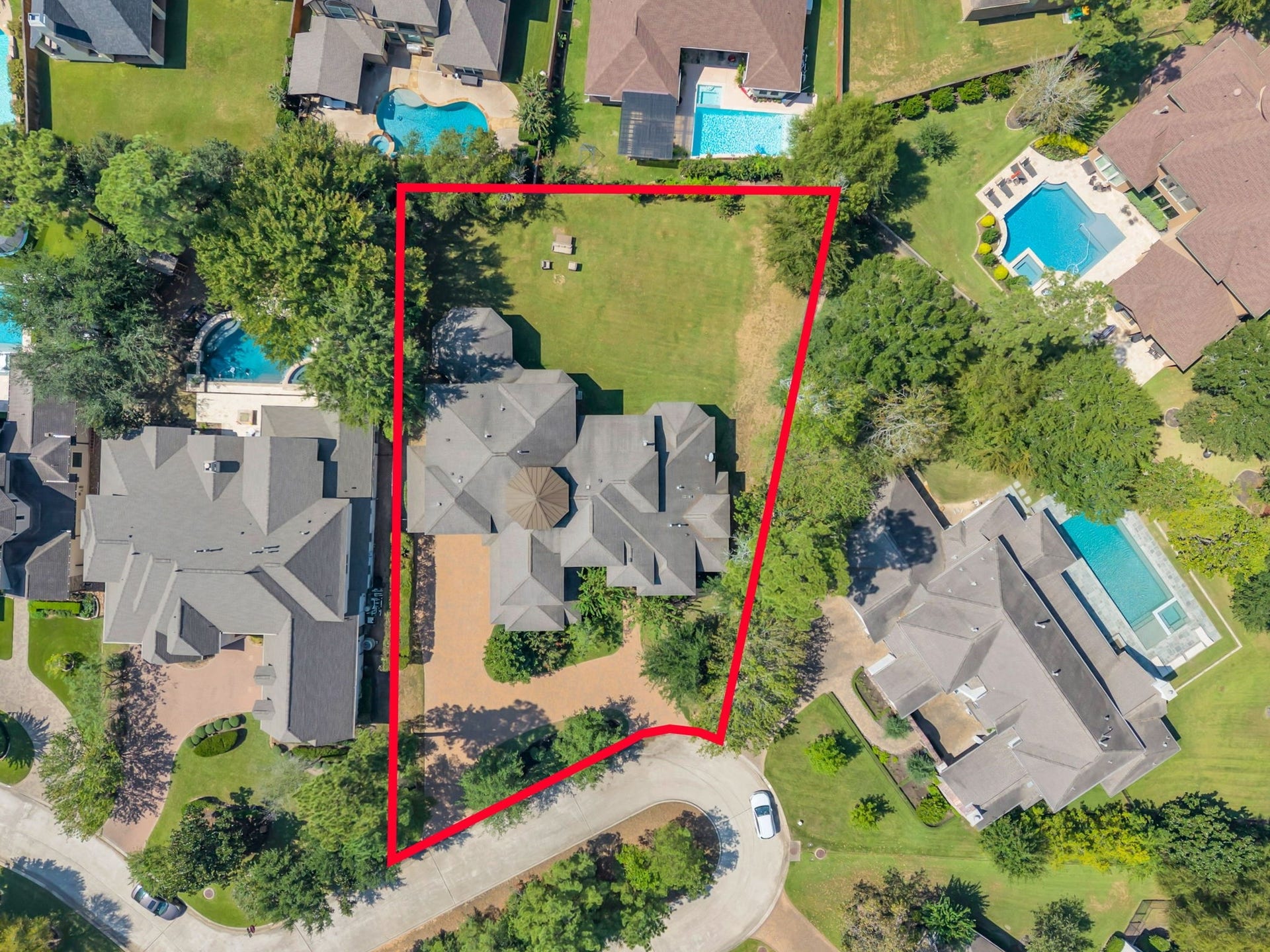 Birds-eye view highlighting the home, grounds and generous outdoor space.