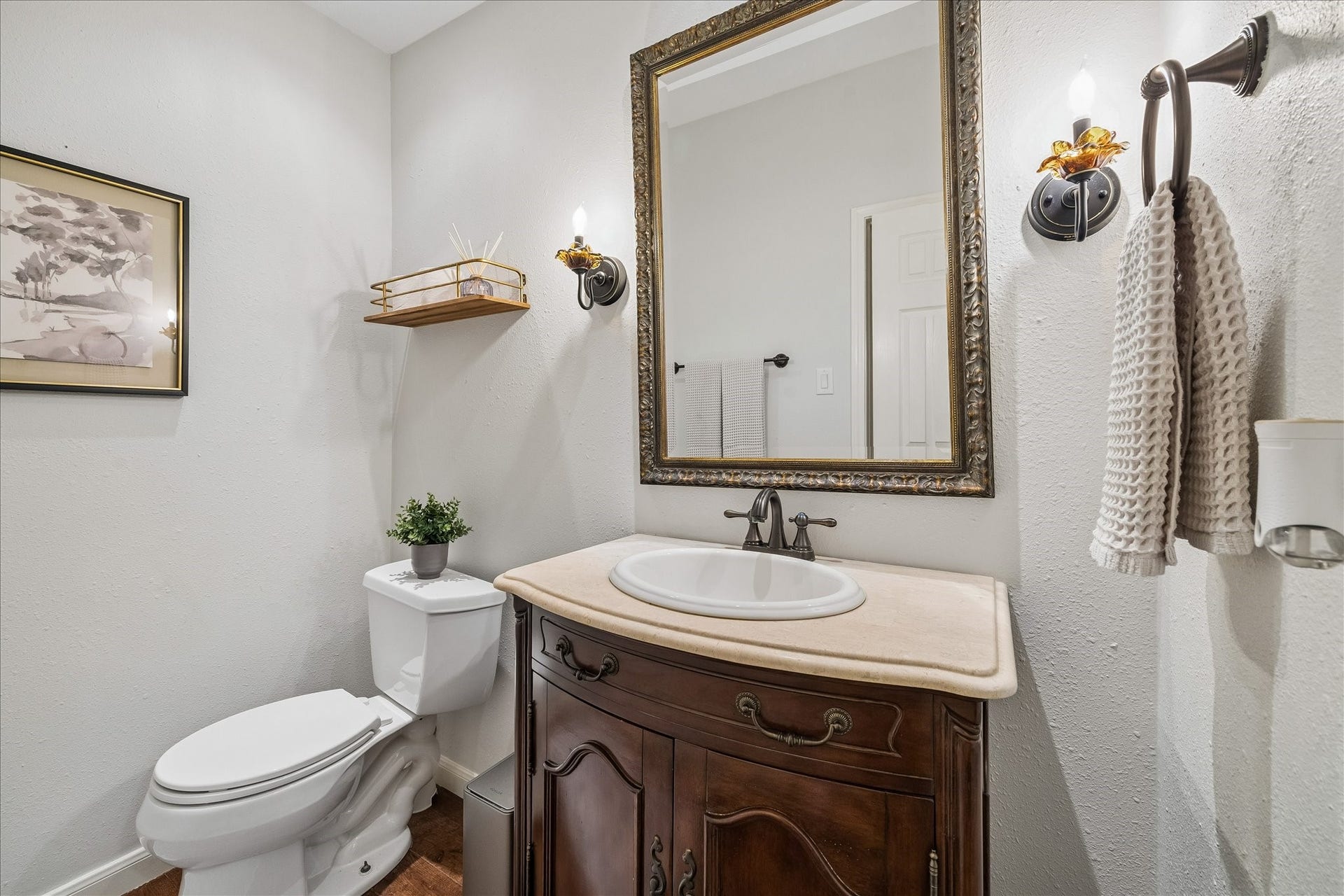 Half bath conveniently located near the secondary bedroom and living area.