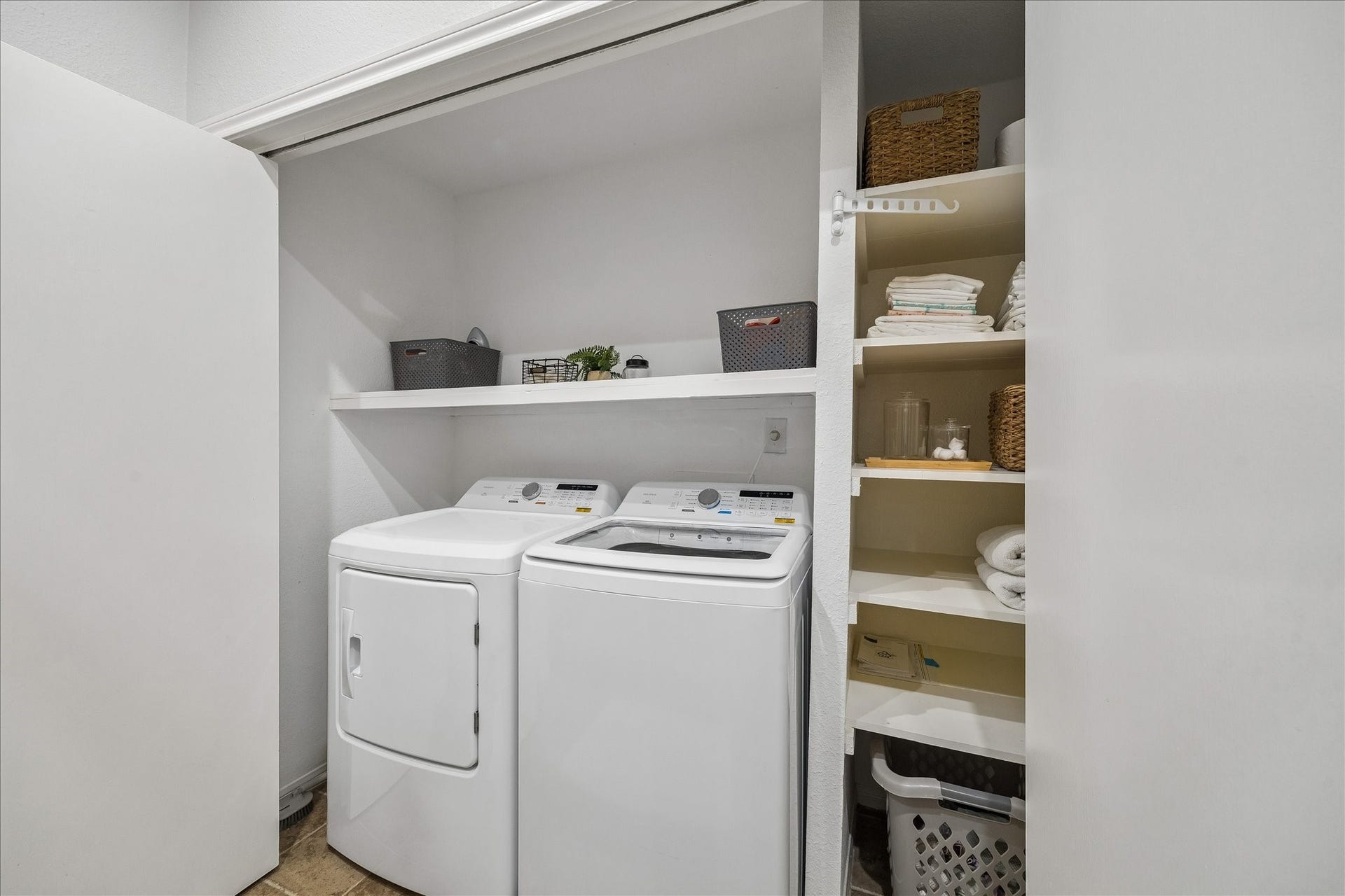 Convenient in-unit laundry area with brand-new washer and dryer."