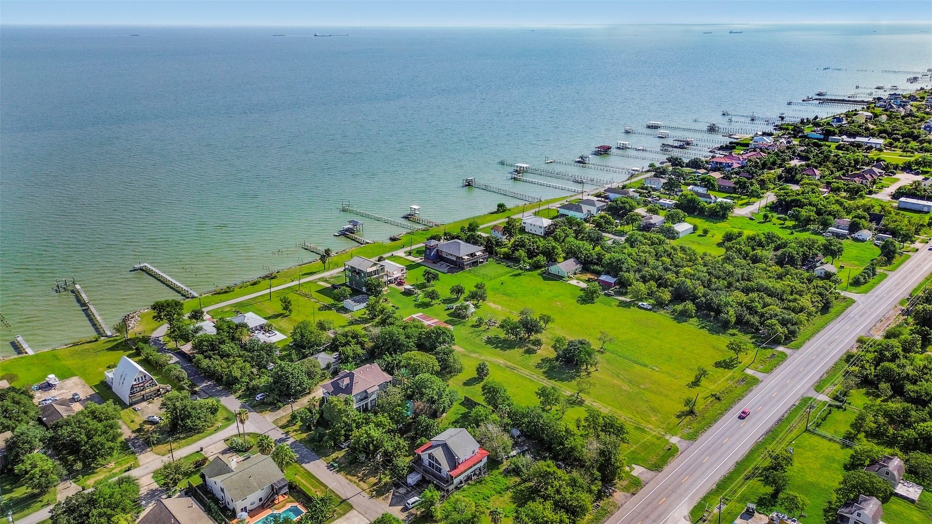 2480 E East Bayshore Drive, San Leon, TX 77539 Coastal living at its finest with stunning waterfront views, lush greenery, and charming homes, all just steps from the shoreline, restaurants and local shops.