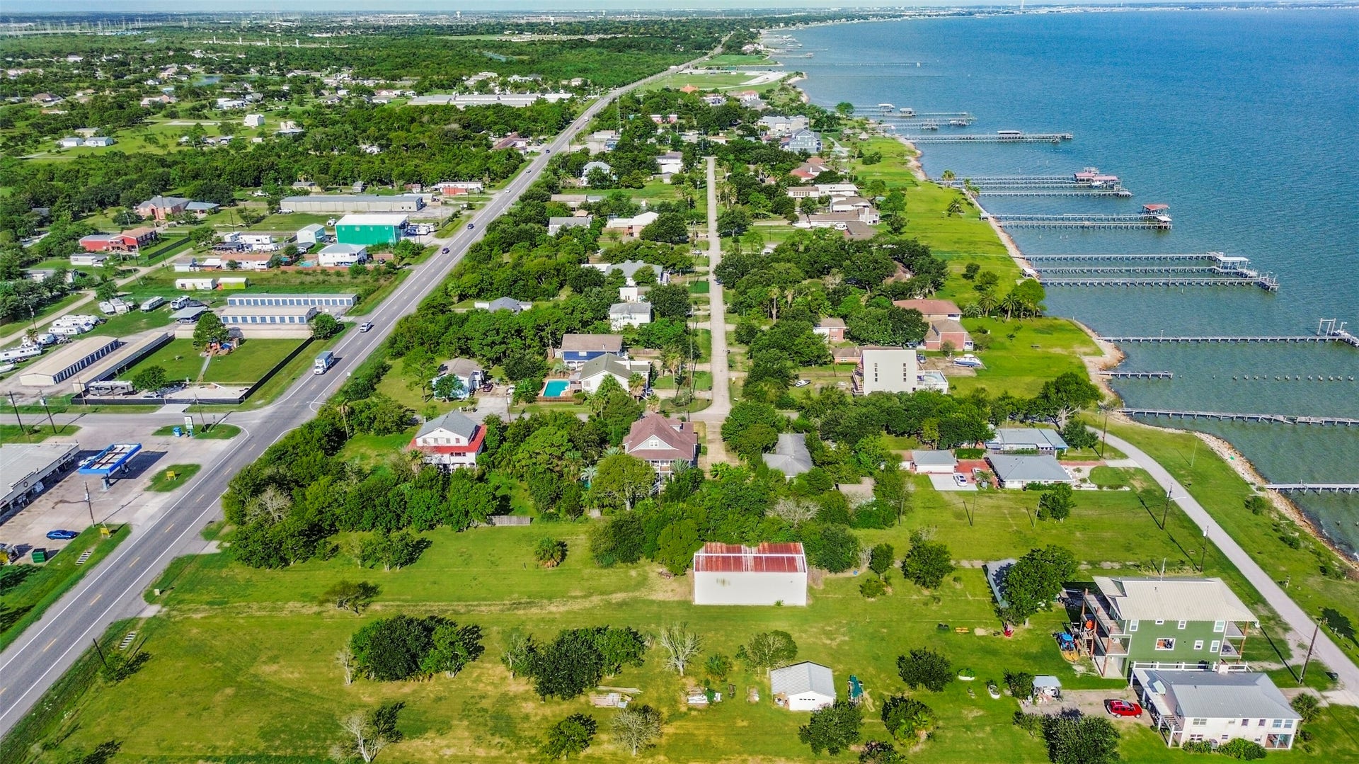 2480 E East Bayshore Drive, San Leon, TX 77539 Charming coastal neighborhood with lush greenery and direct water access, offering picturesque views and serene living by the bay.
