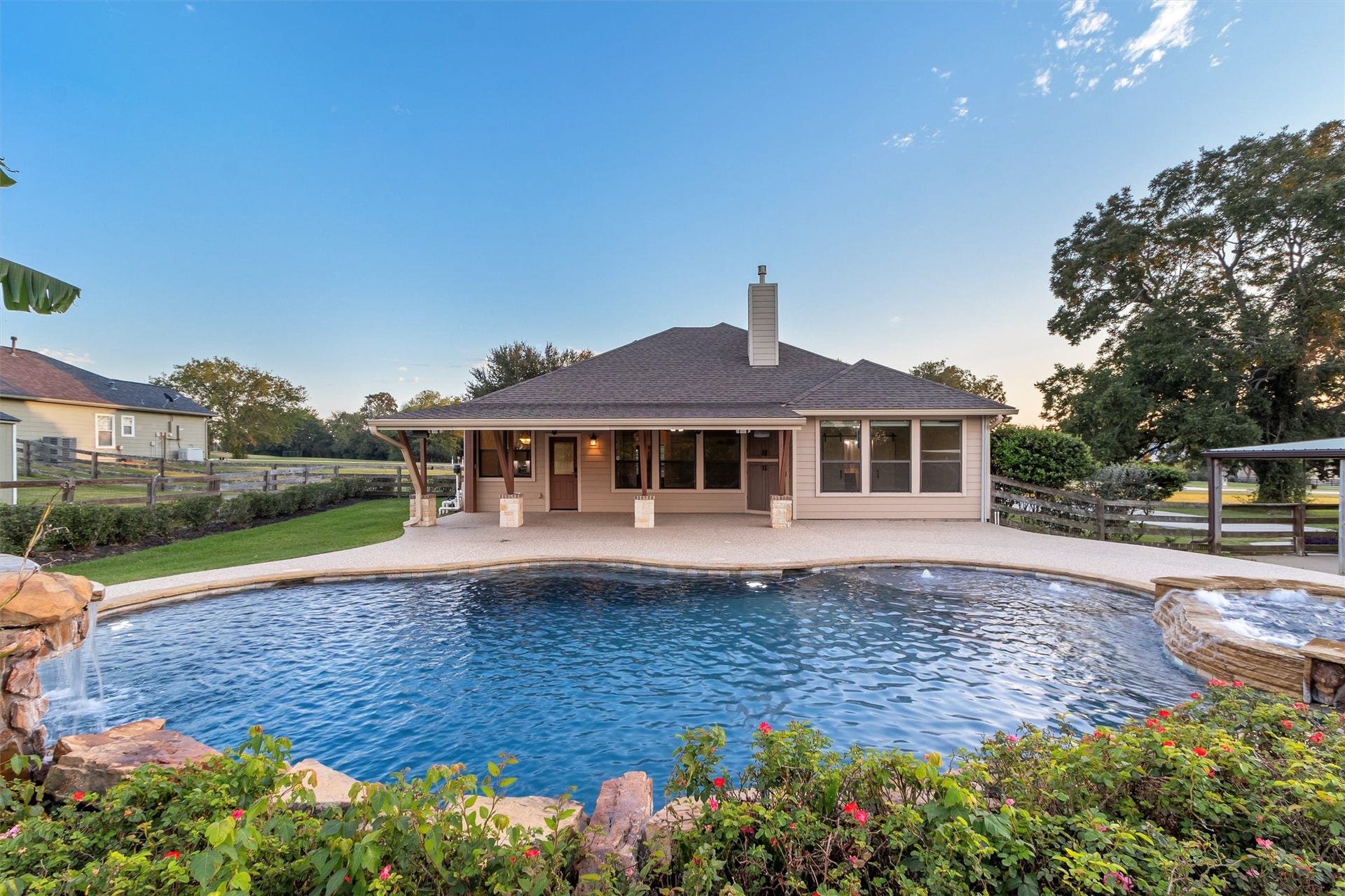 22078 Stone Creek Lane, Montgomery, TX 77316 Your Very Own Backyard Paradise! Dive into luxury with this stunning resort-style pool featuring beautiful rock waterfalls, a relaxing hot tub, and lush landscaping! The expansive covered patio offers the perfect setting for outdoor entertaining, while the spacious 1-acre property and no back neighbors provide added privacy. Every day feels like a vacation in your own backyard!