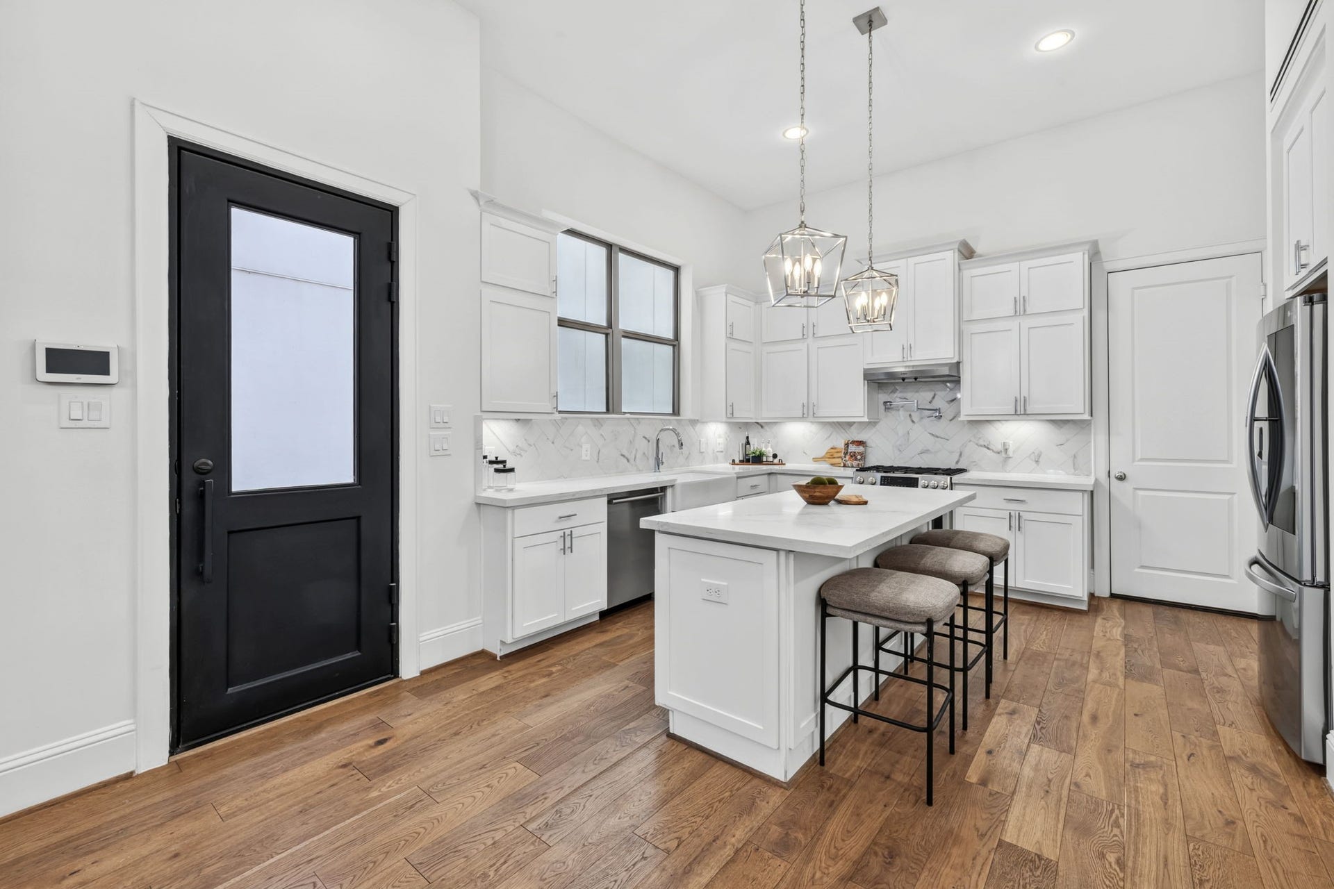 1713 Holman Street, Houston, TX 77004 Welcome guests through a dramatic iron door entry.