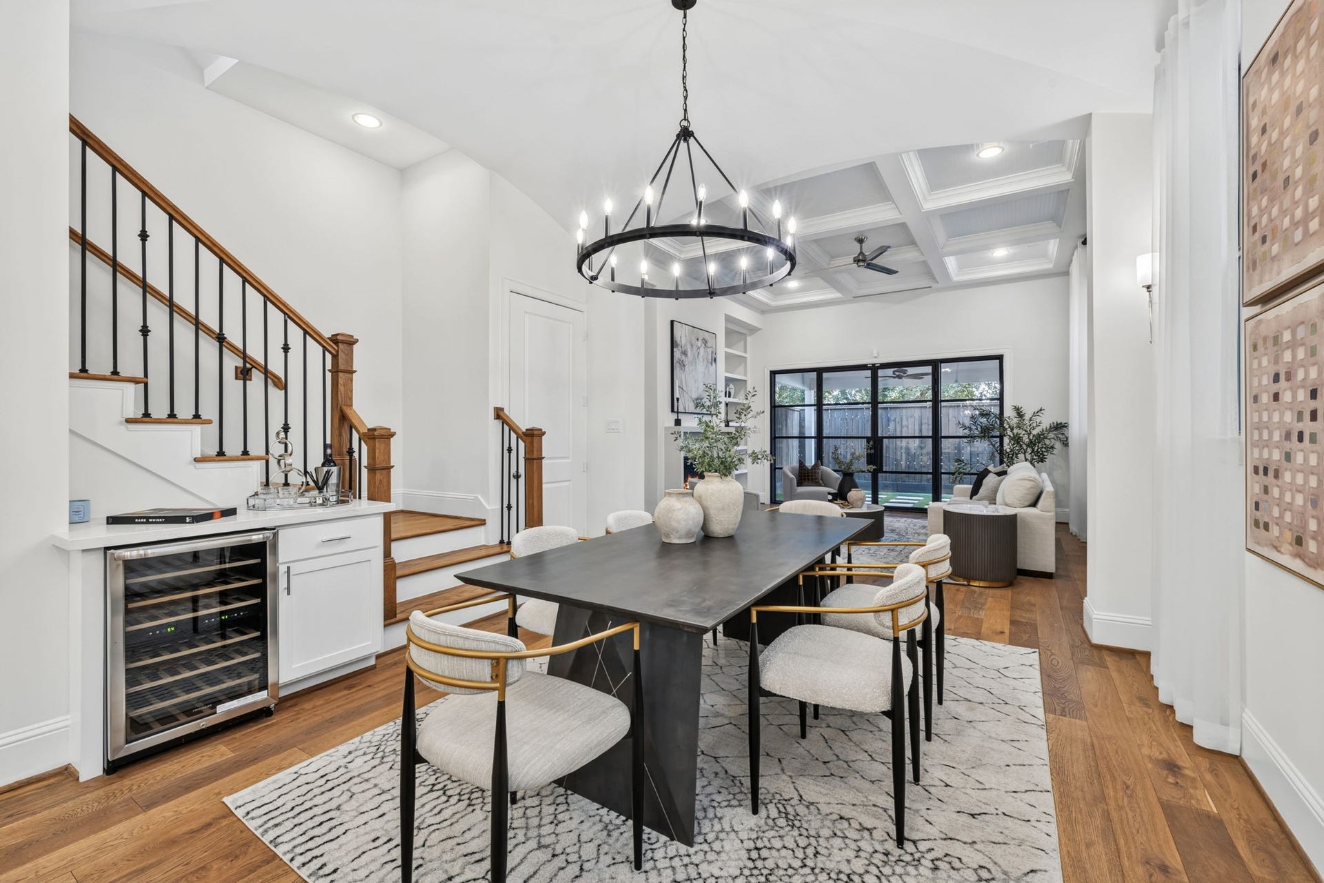 1713 Holman Street, Houston, TX 77004 Stunning first floor living featuring custom iron glass doors that open wide to the patio for seamless indoor-outdoor living and effortless entertaining.