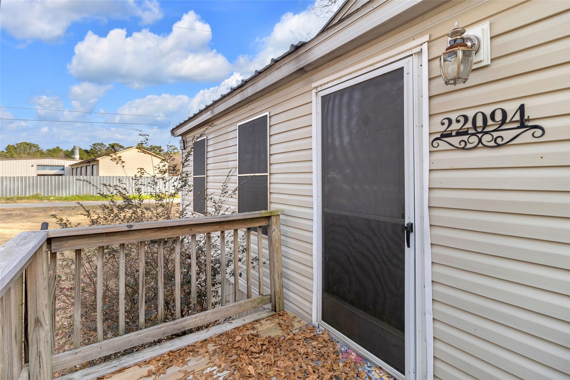 Primary front access door offering easy and direct entry to the residence.