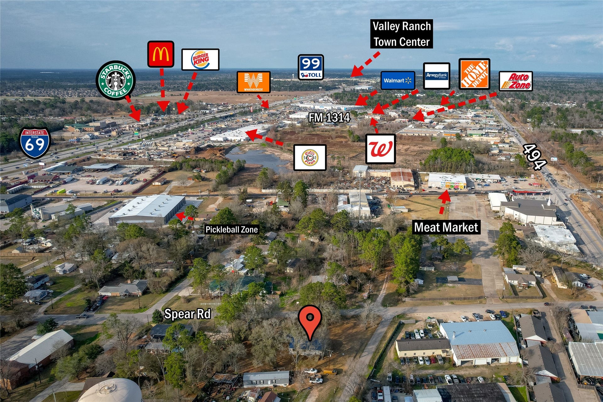 This aerial photo highlights a residential area with nearby amenities, including popular retail stores, fast-food restaurants, and a shopping center. Major roads and highways provide convenient access to these locations, making it an ideal spot for those seeking proximity to essential services and dining options.