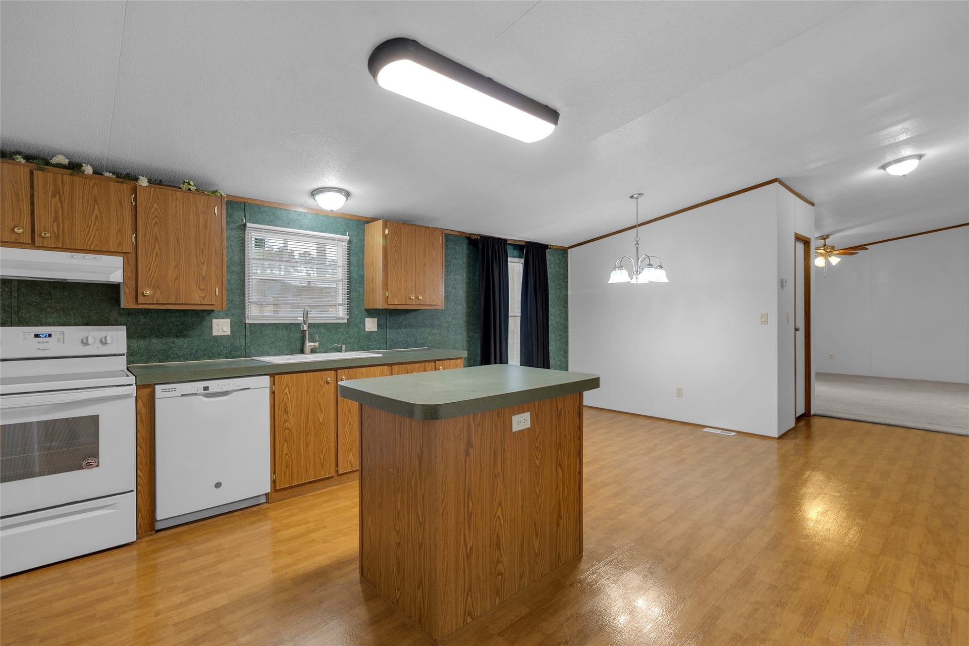 Spacious kitchen featuring a generous center island, offering additional workspace.