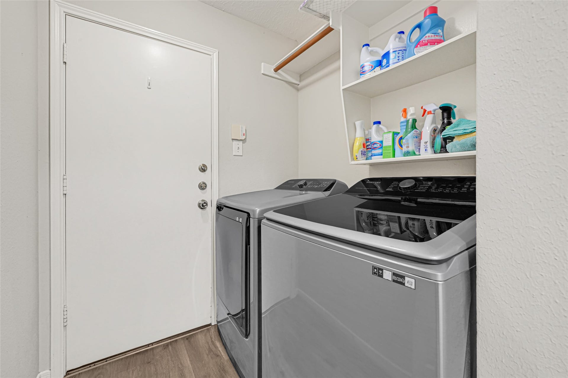 804 Cherry Blossom Drive, League City, TX 77573 indoor laundry room leads to the garage. Garage has epoxy flooring for a finished/elevated look