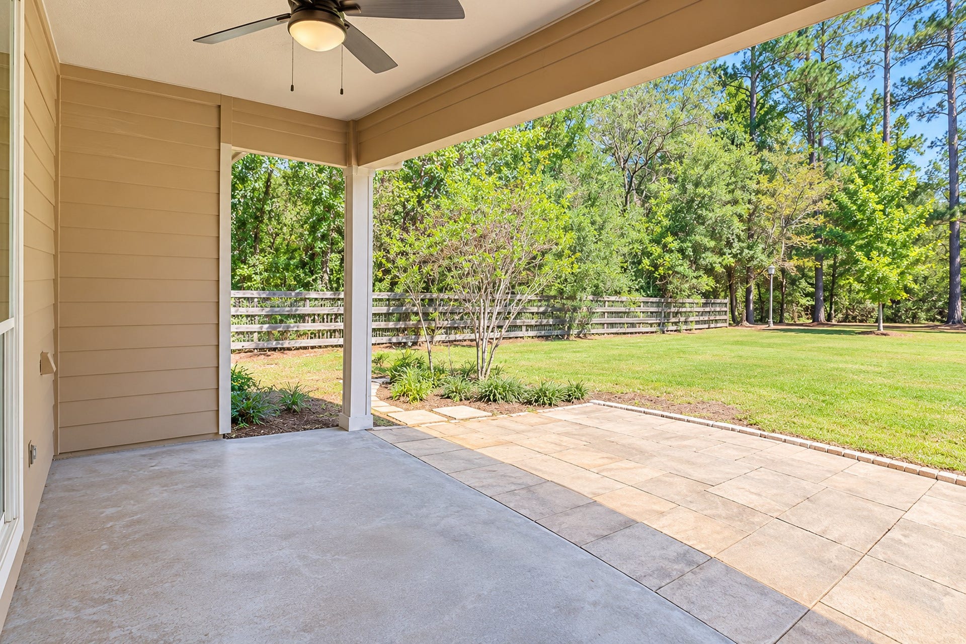 346 Skylark Street, Magnolia, TX 77355 What a wonderful place to enjoy the outdoors! The spacious covered back patio features a ceiling fan and opens to an extended patio overlooking the expansive, tree-lined backyard. Perfect for relaxing, entertaining, or enjoying a quiet Texas evening.