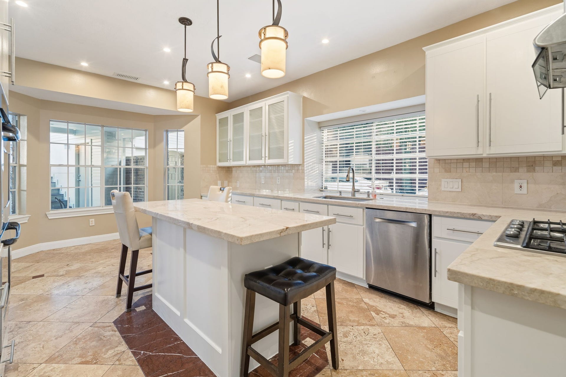 14114 Scarborough Fair Street, Houston, TX 77077 Custom lighting fixtures over top the island as well as dimmable lighting throughout kitchen.